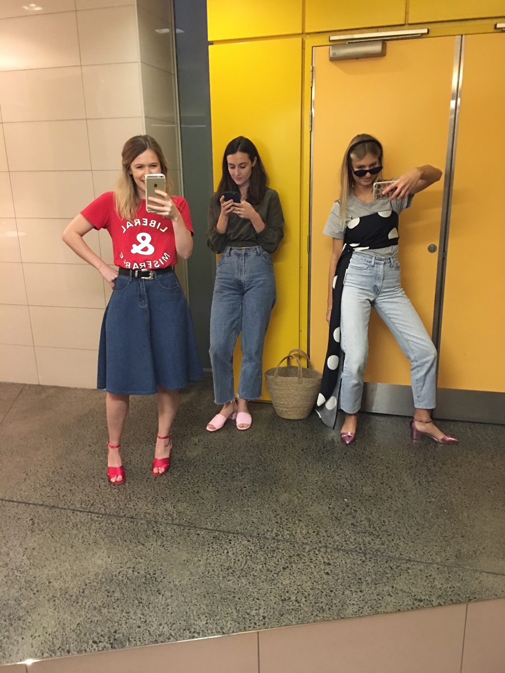 Zoe Walker Ahwa (left) wearing the Karen Walker 'Liberal & Miserable' T-shirt (pictured with Viva colleagues Jessica Beresford and Rosie Kelway in 2016).
