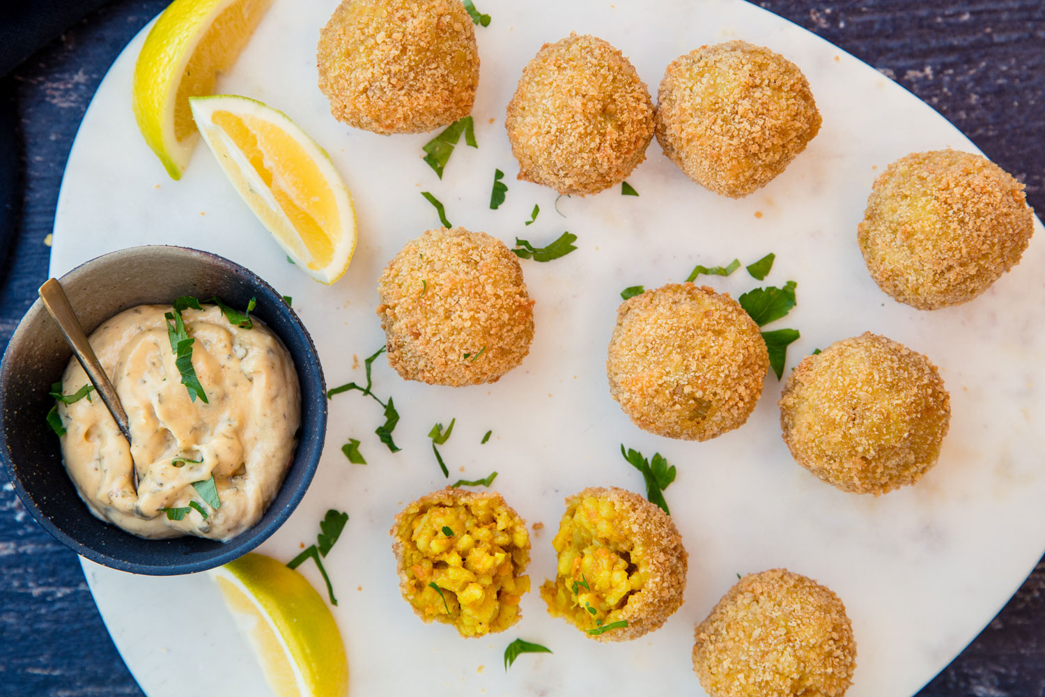 Creamy risotto is coated with breadcrumbs in this seasonal appetiser. Photo / Babiche Martins
