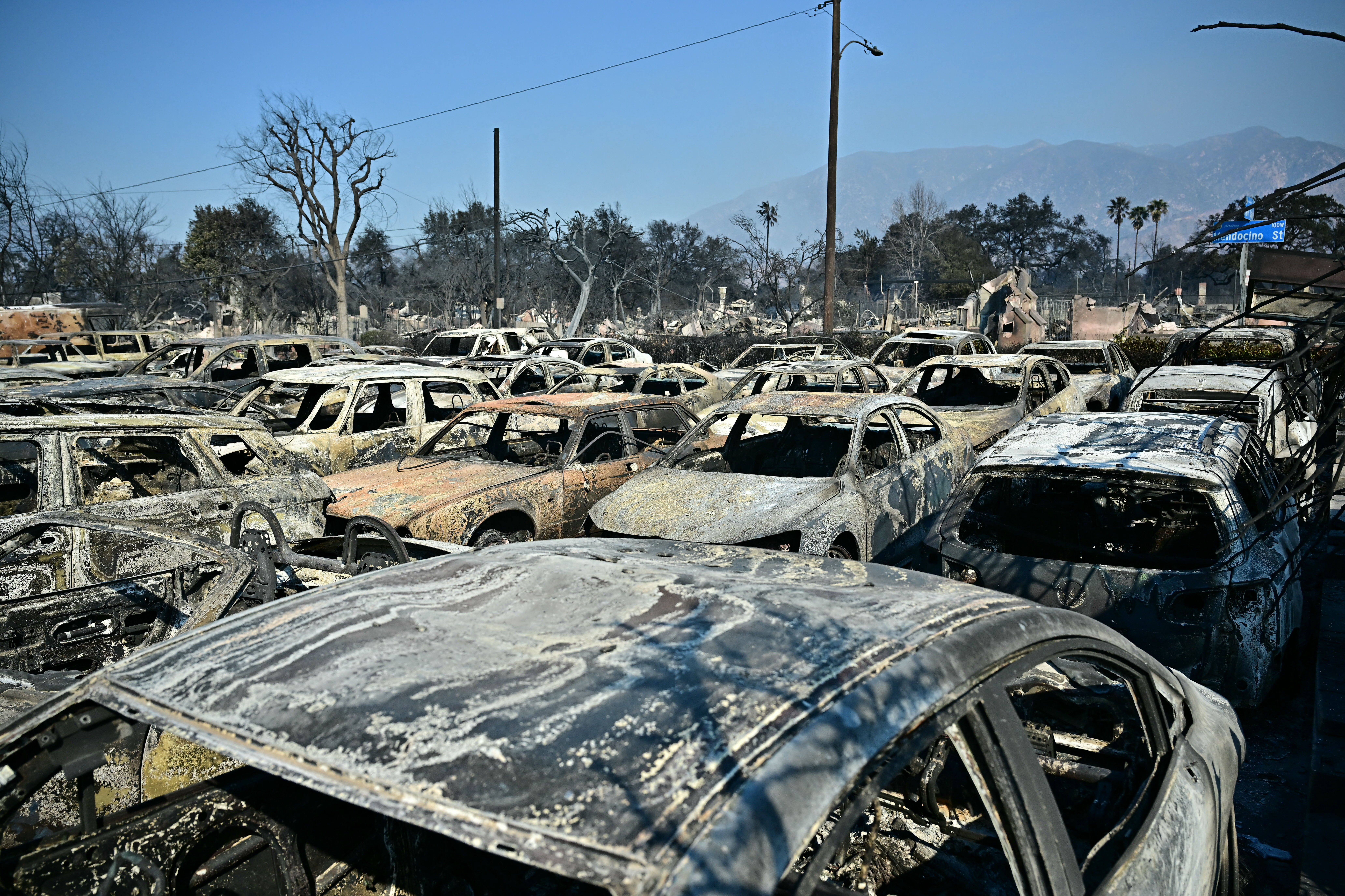 Cars belonging to the Altadena Auto Centre dealership destroyed by the Eaton fire remain parked in a lot in Altadena in Los Angeles. Photo / AFP