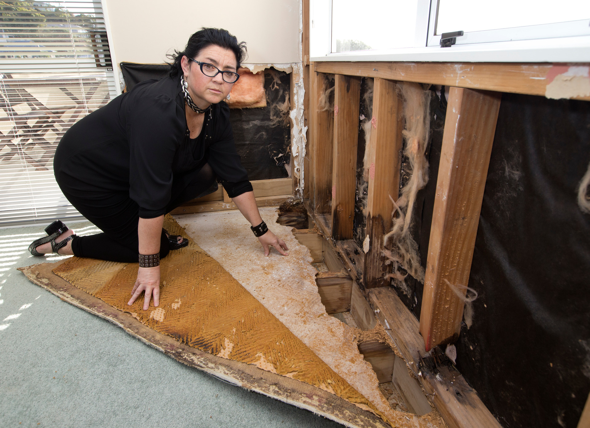Sharon Leigh in a water-damaged room in her Porirua house in 2015. Photo / Mark Mitchell. 