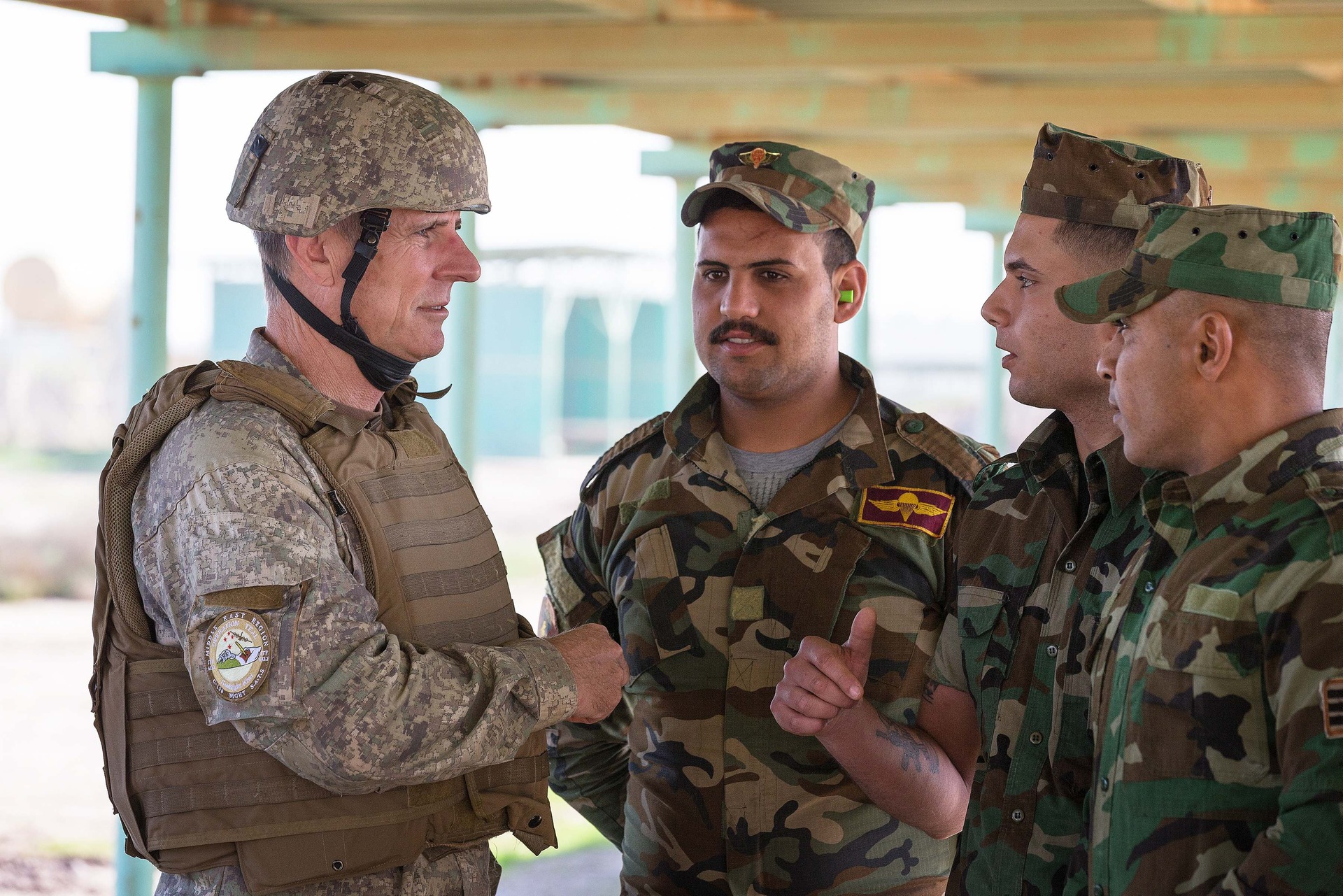 Defence Force chief Lieutenant General Timothy Keating, seen here talking to Iraqi Army soldiers, was given authority to make an immediate payment if necessary. Photo / NZ Defence Force.