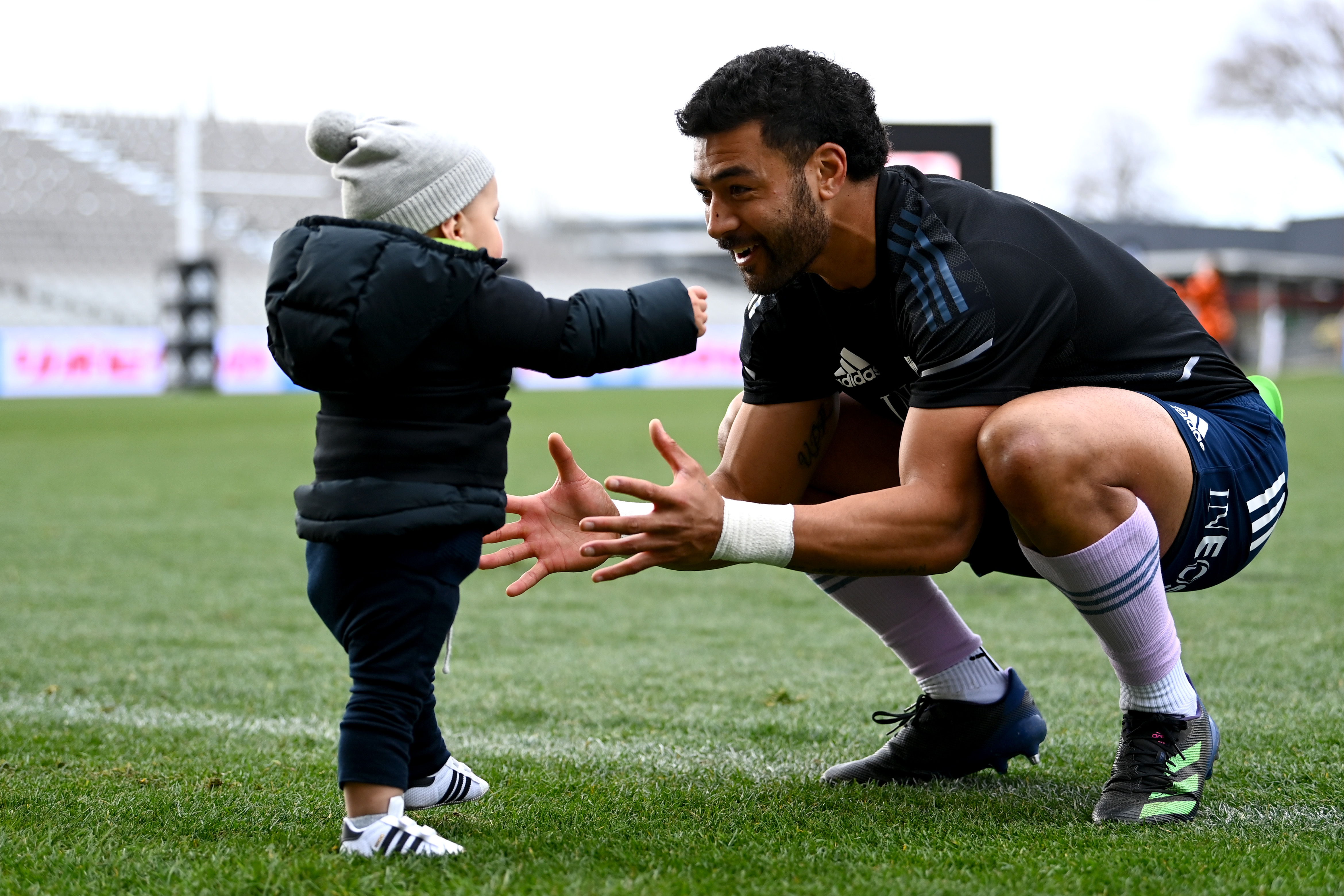 Richie Mo'unga picks up his son Marley. Photo / Getty