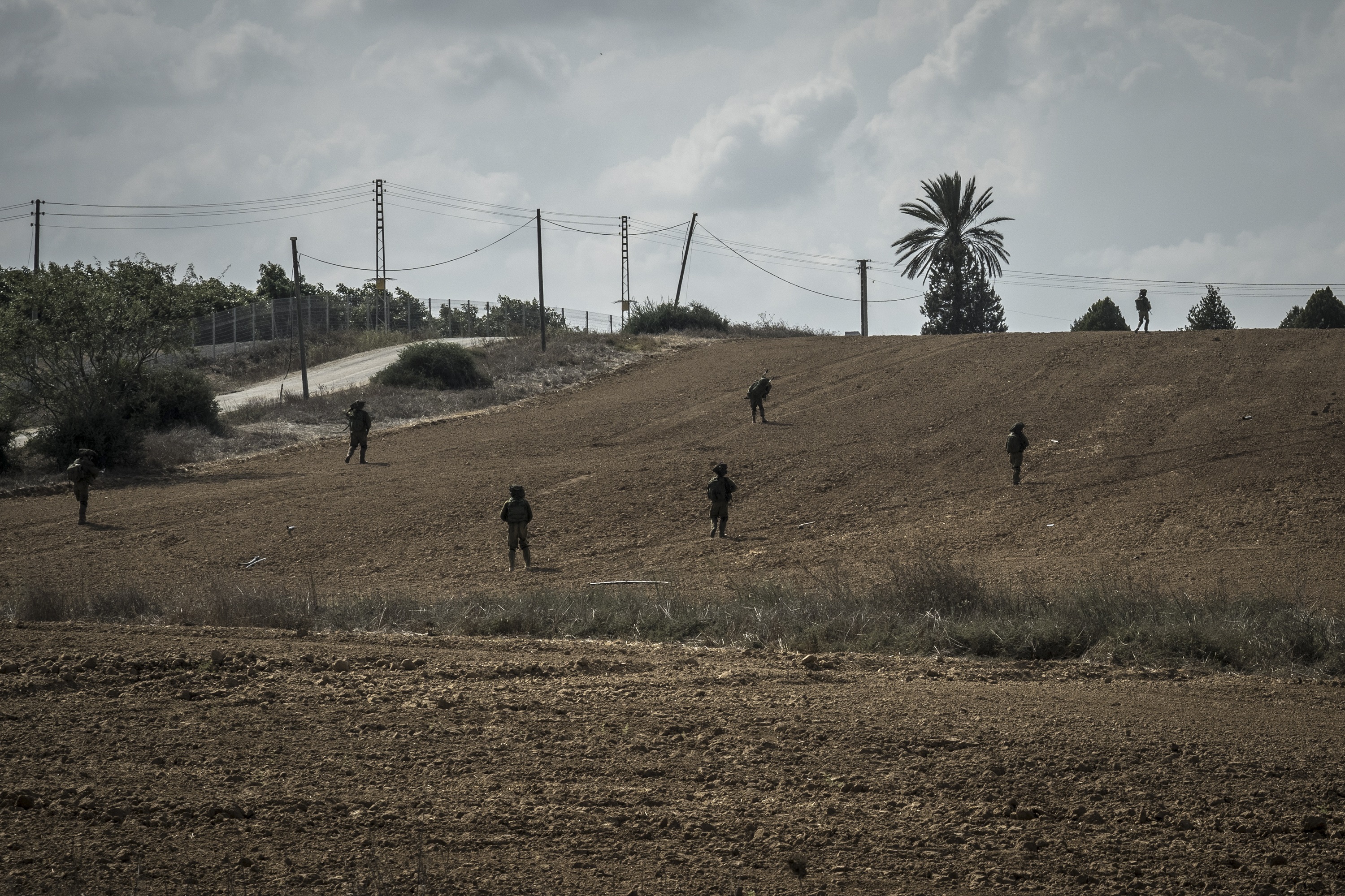 Israeli soldiers on patrol in Kfar Azza. Photo / Sergey Ponomarev, The New York Times