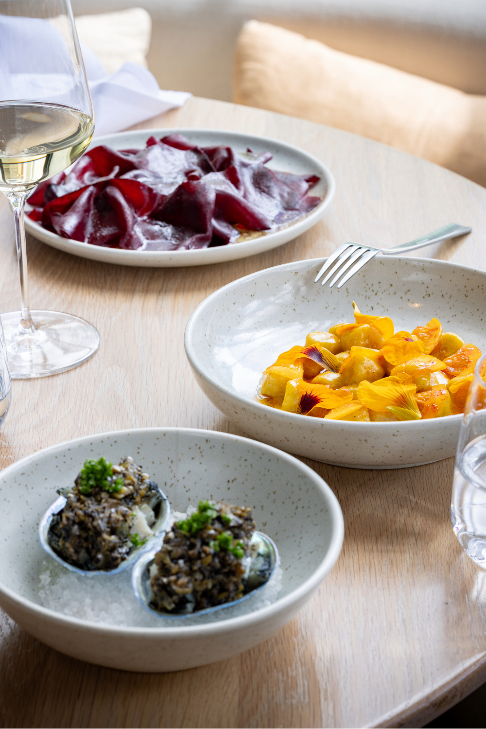 The pāua, pumpkin gnocchi and beetroot dishes on the menu at Mr Morris. Photo / Babiche Martens