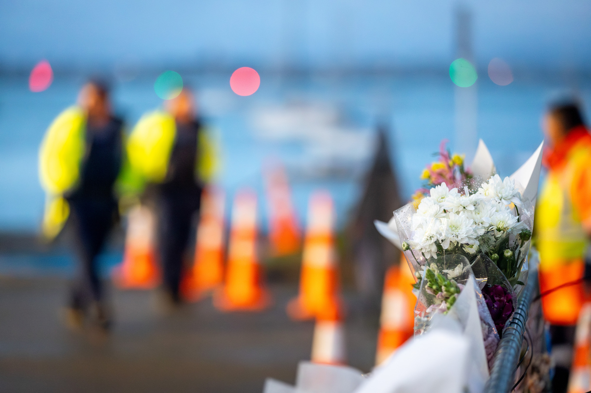 Floral tributes of remembrance left at The Mall, Pilot bay. Photo / Michael Craig