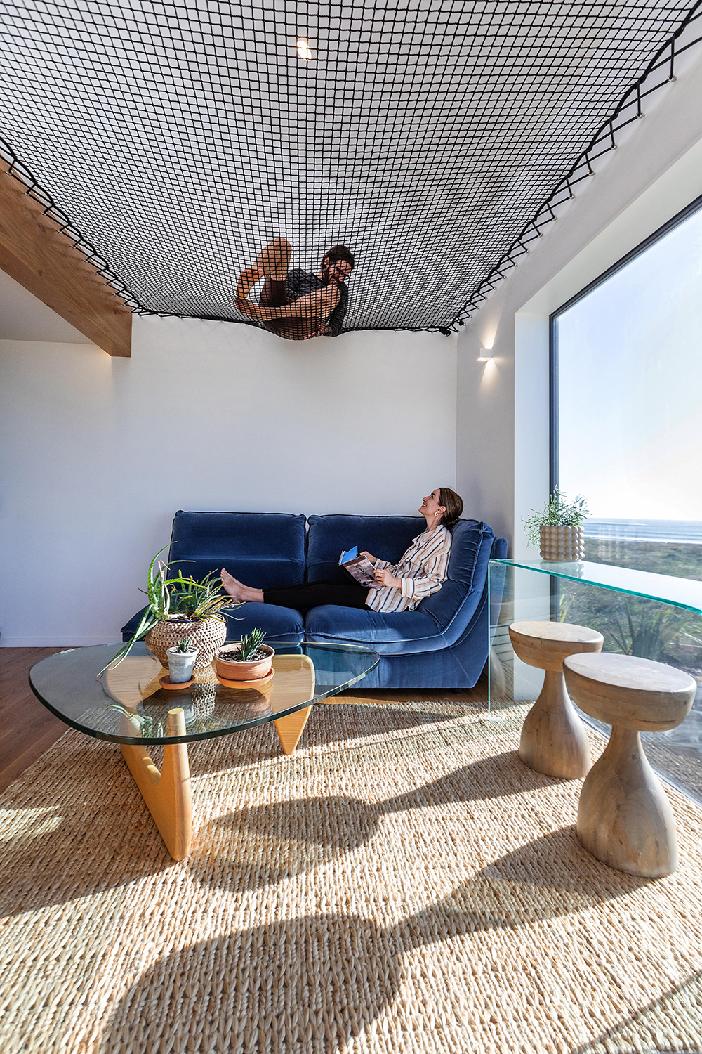 The M + M House boasts a net room divider. Photo / Sandra Henderson