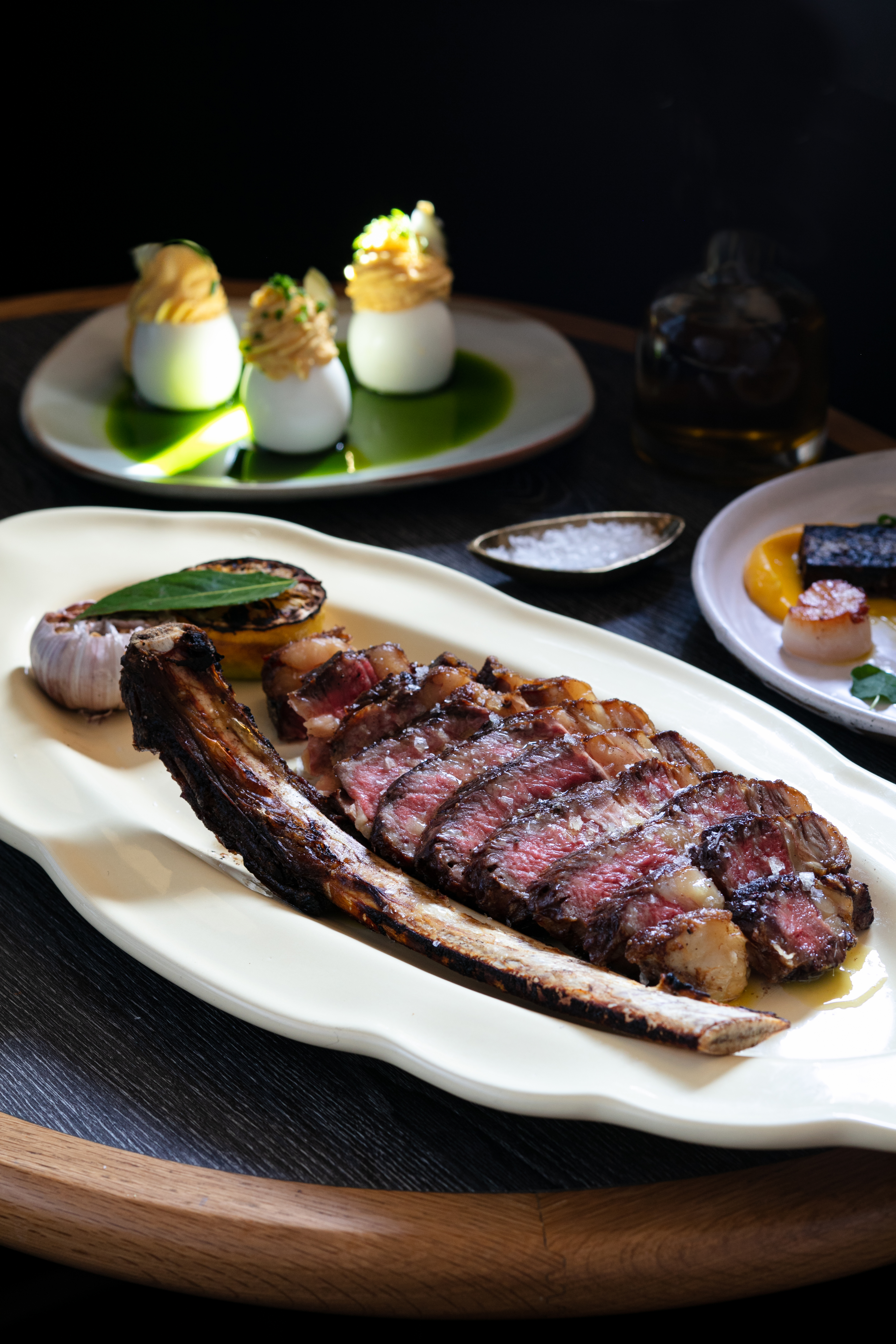 The T-bone dairy steak, scallops with black pudding and devilled eggs on the menu at Esther restaurant in QT Hotel. Photo / Babiche Martens