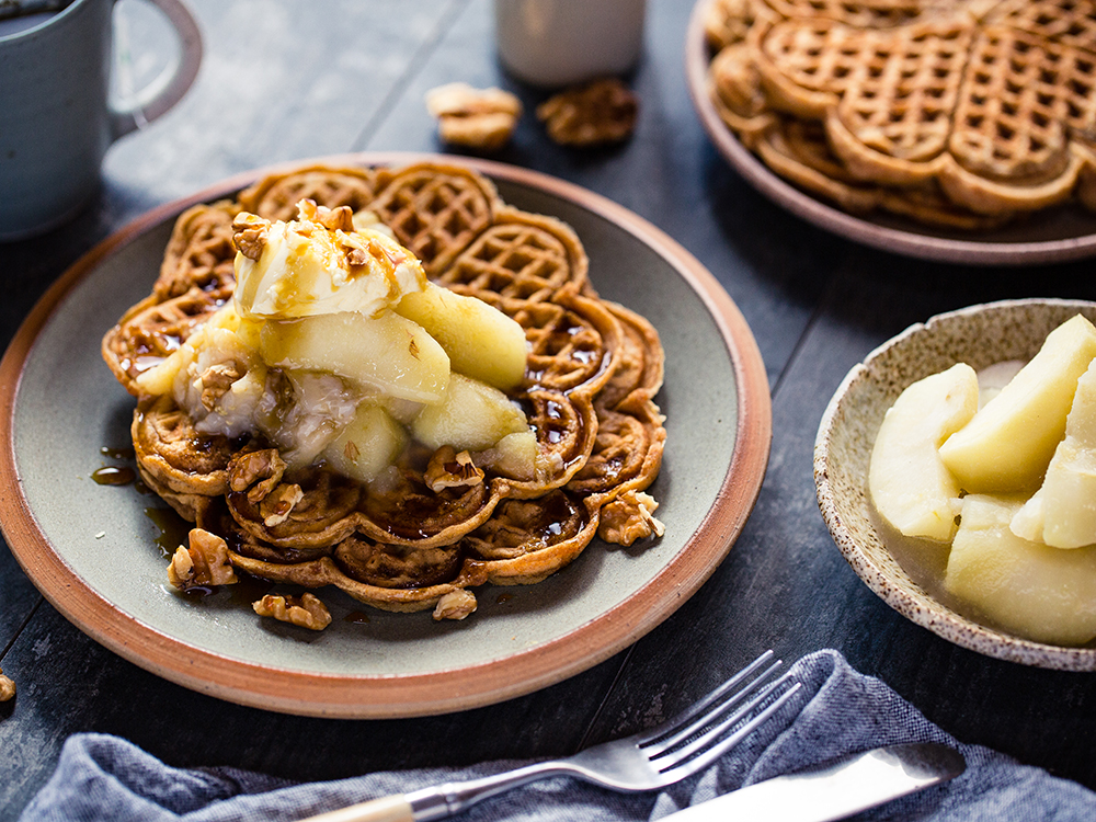 Enjoy waffles drizzled with maple syrup and stewed fruit. Photo / Babiche Martens
