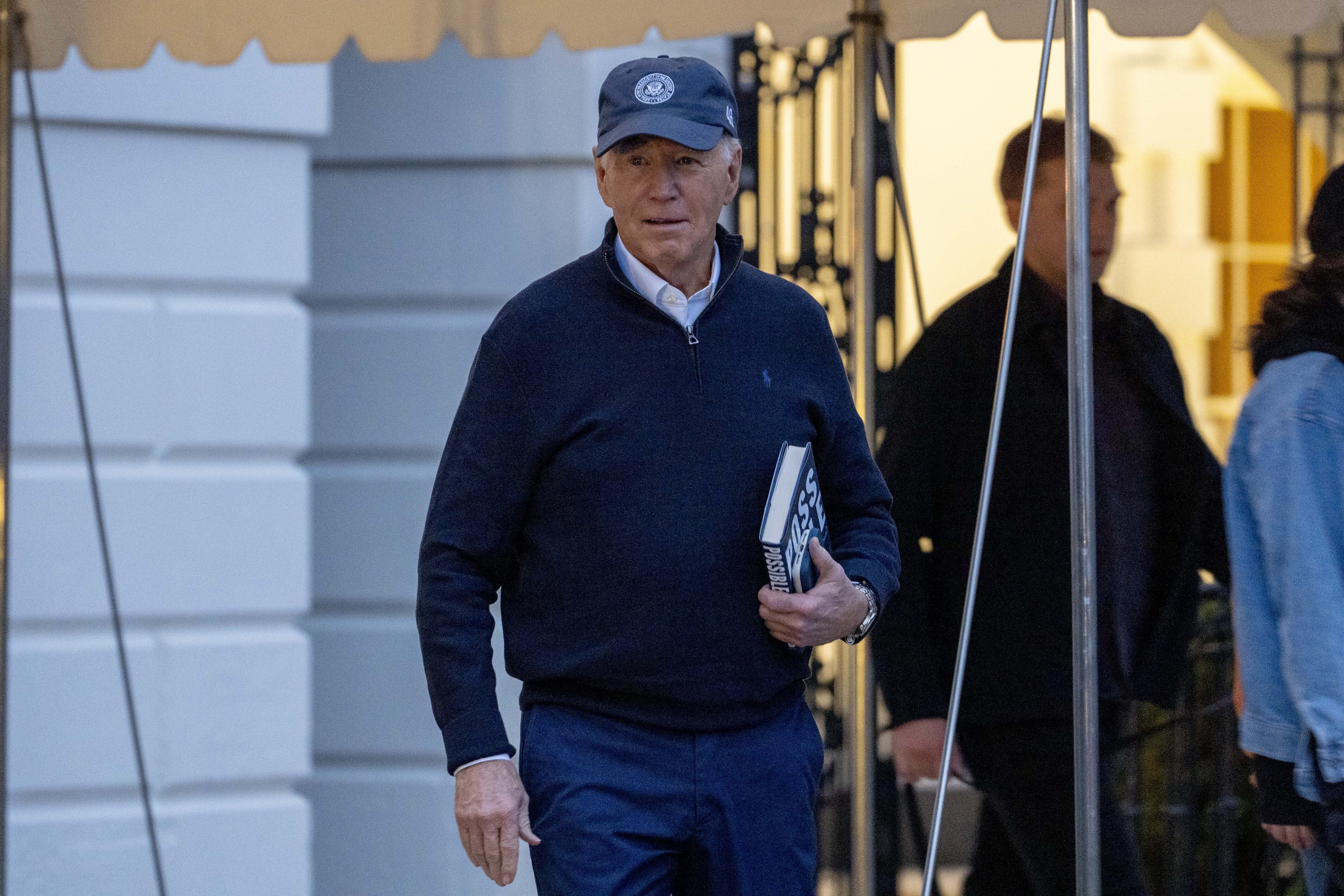 President Joe Biden walks towards members of the media before boarding Marine One on the South Lawn of the White House in Washington to travel to Camp David for the weekend. Photo / AP