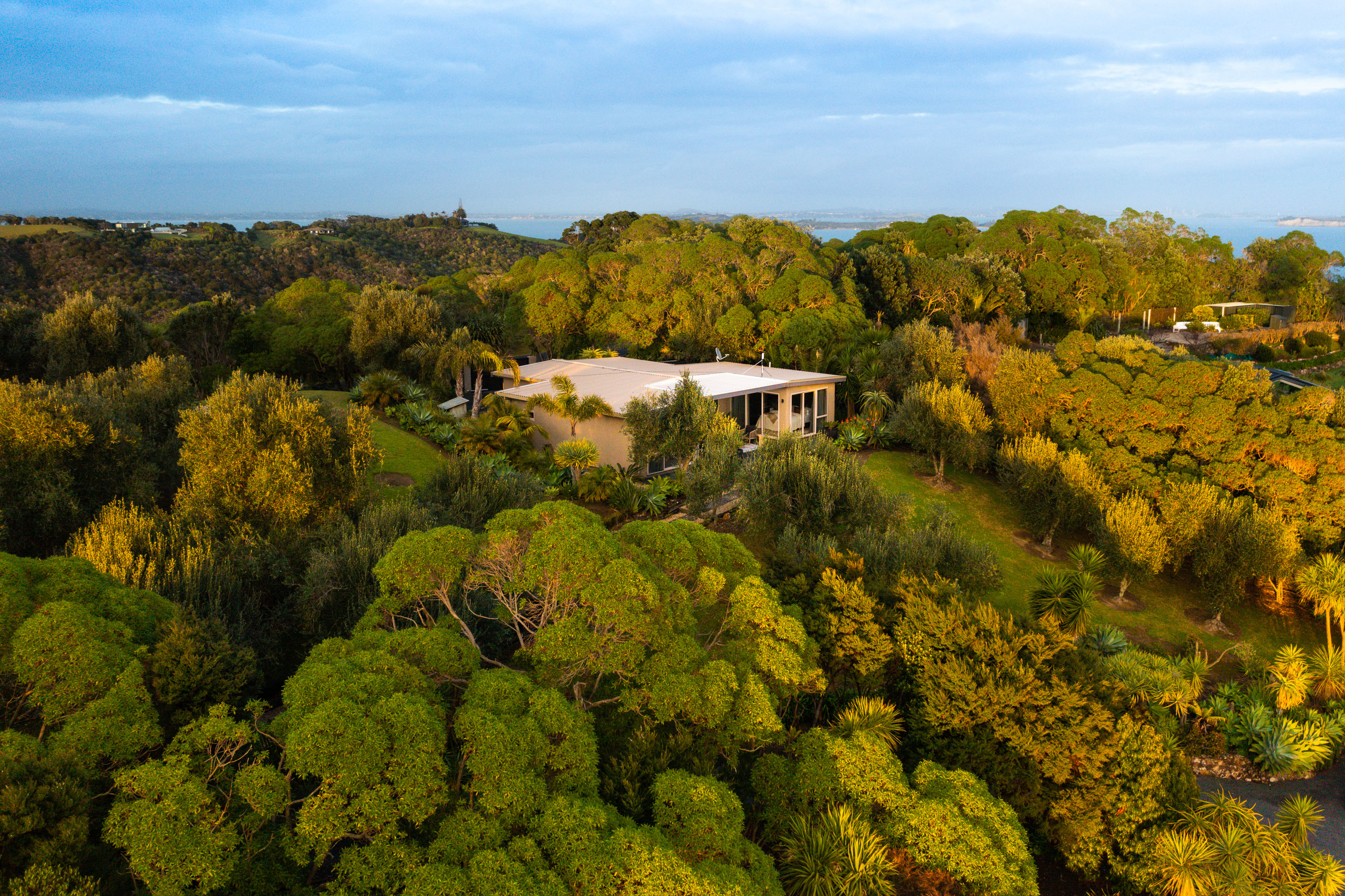An aerial shot of the Ataahua Owners Villa at Delamore Lodge displays its enviable position nestled among native bush.