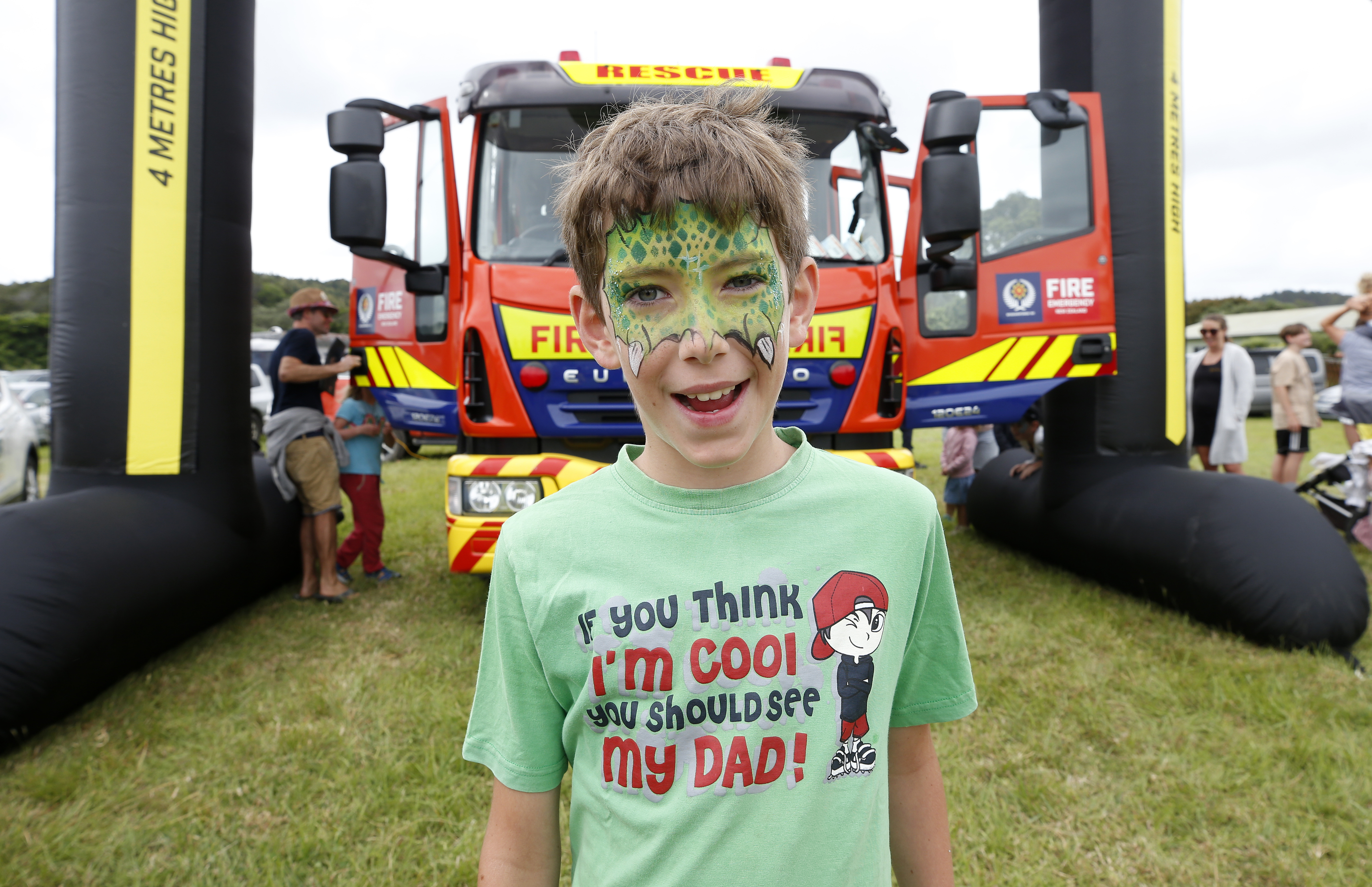 Ethan Reynolds, 8, from Whangārei, all smiles with a freshly-painted face in front of a fire engine from the Ngunguru Fire Brigade at the Matapouri Gala Day on Monday.
