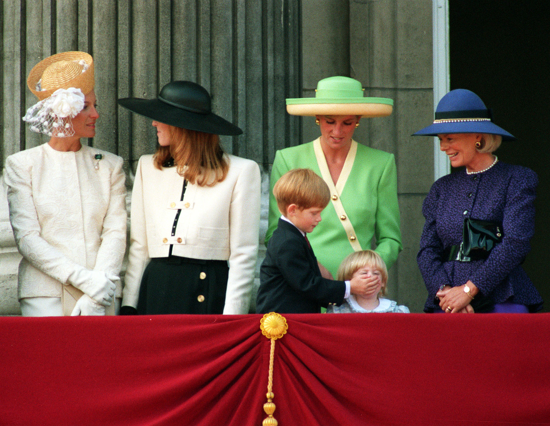 Prince Harry puts his hand over the mouth of 2-year-old Princess Beatrice. Photo / Getty Images