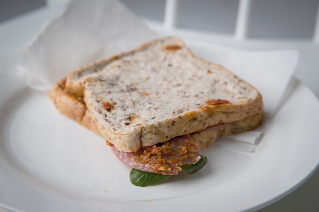 Greg's favourite sandwich: salami and spinach on Molenberg bread with pesto and hot sauce. Photo / Dean Purcell