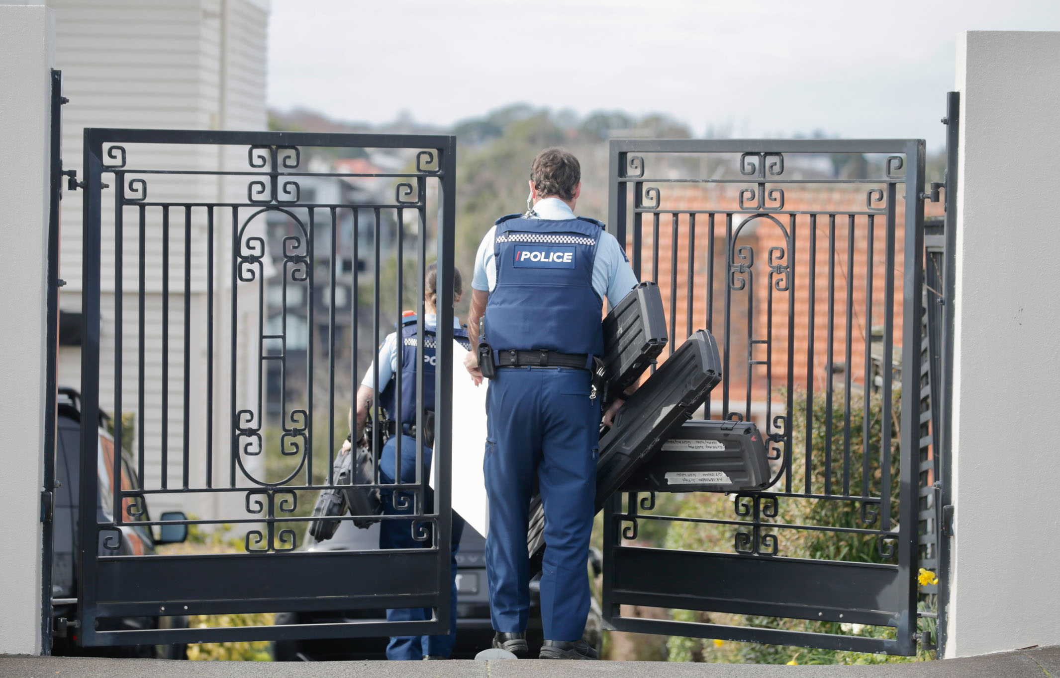 FMA officers at a Du Val property address in Auckland on Friday 2 August, 2024 
New Zealand Herald photograph by Alex Burton