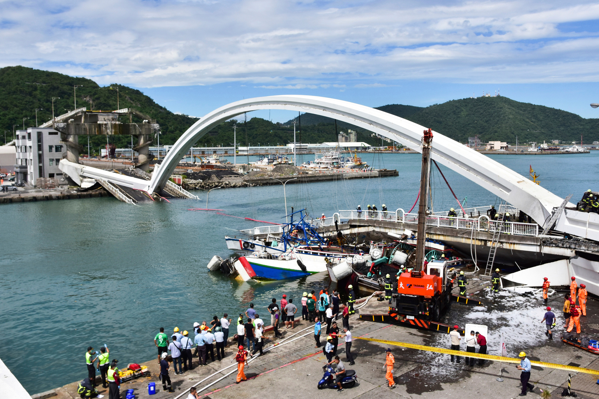 Rescuers work near the site of a collapsed bridge in Nanfangao, eastern Taiwan. Photo / AP