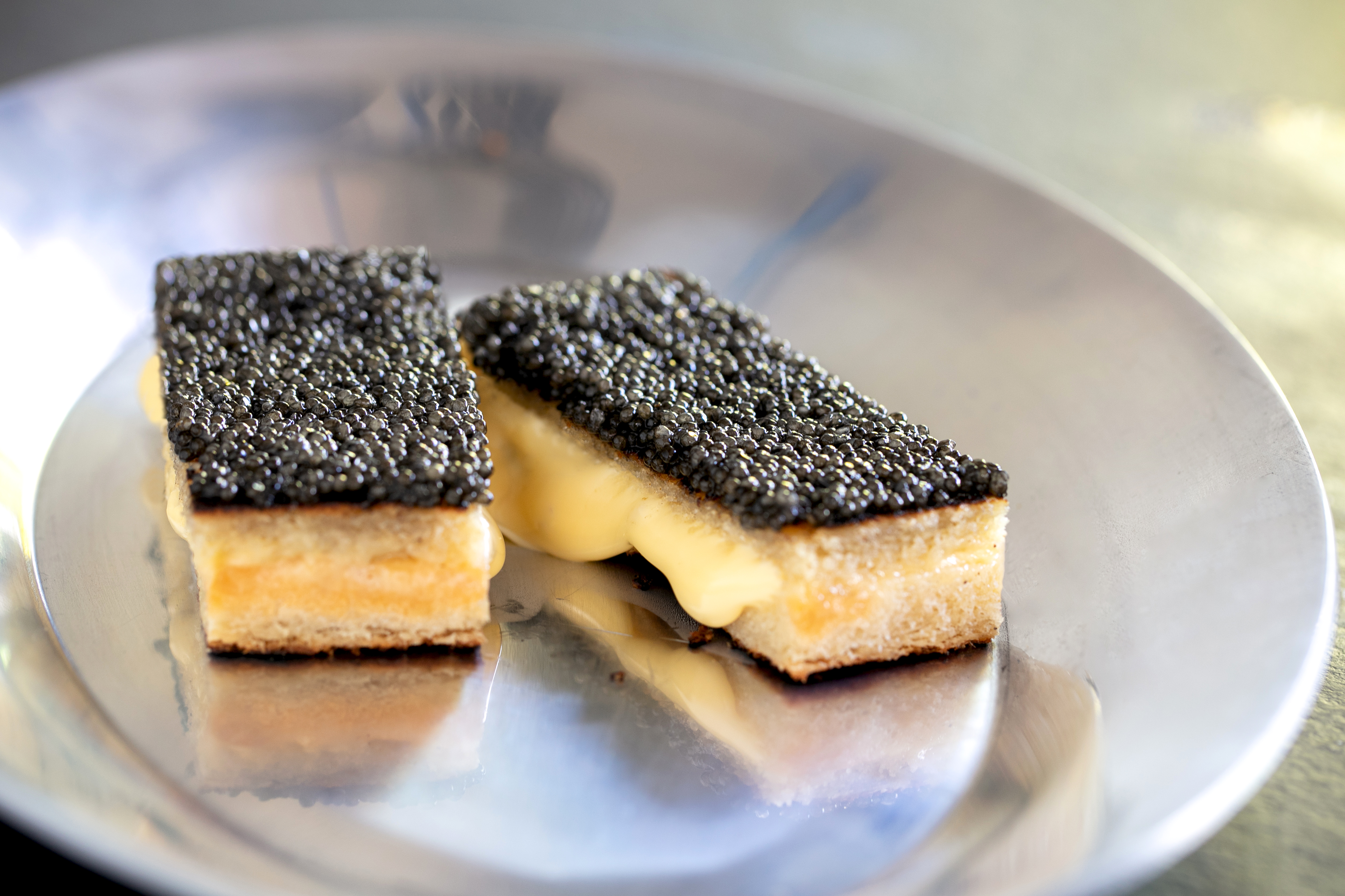 Woodfired grilled cheese and caviar, from the menu at Alpha restaurant in Parnell, Auckland. Photo / Babiche Martens
