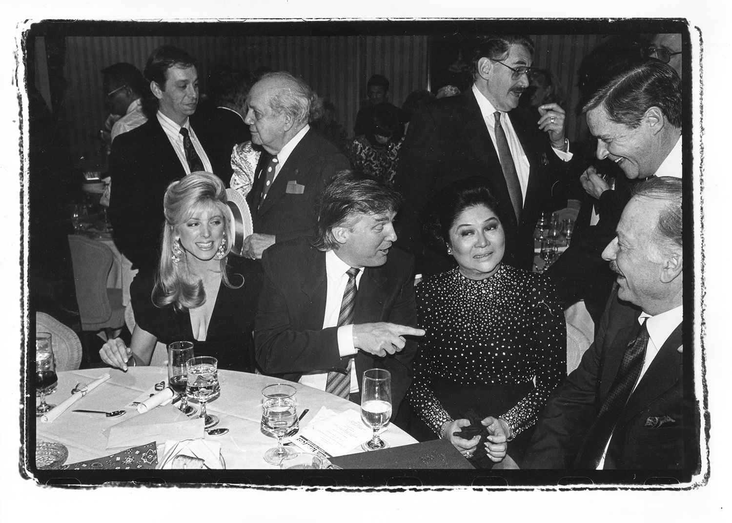 Donald Trump and Marla Maples with Imelda Marcos at a party at the Helmsley hotel in 1990. Photo / Dafydd Jones via The New York Times