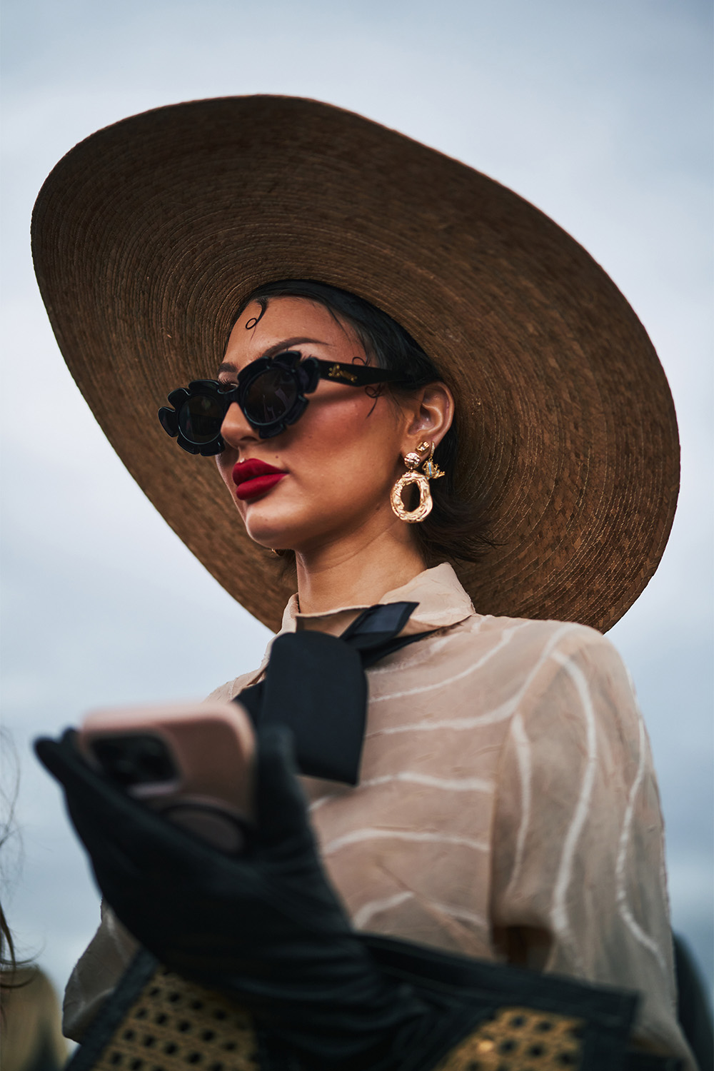 An attendee dons a wide-brim hat. Photo / Simbarashe for The New York Times