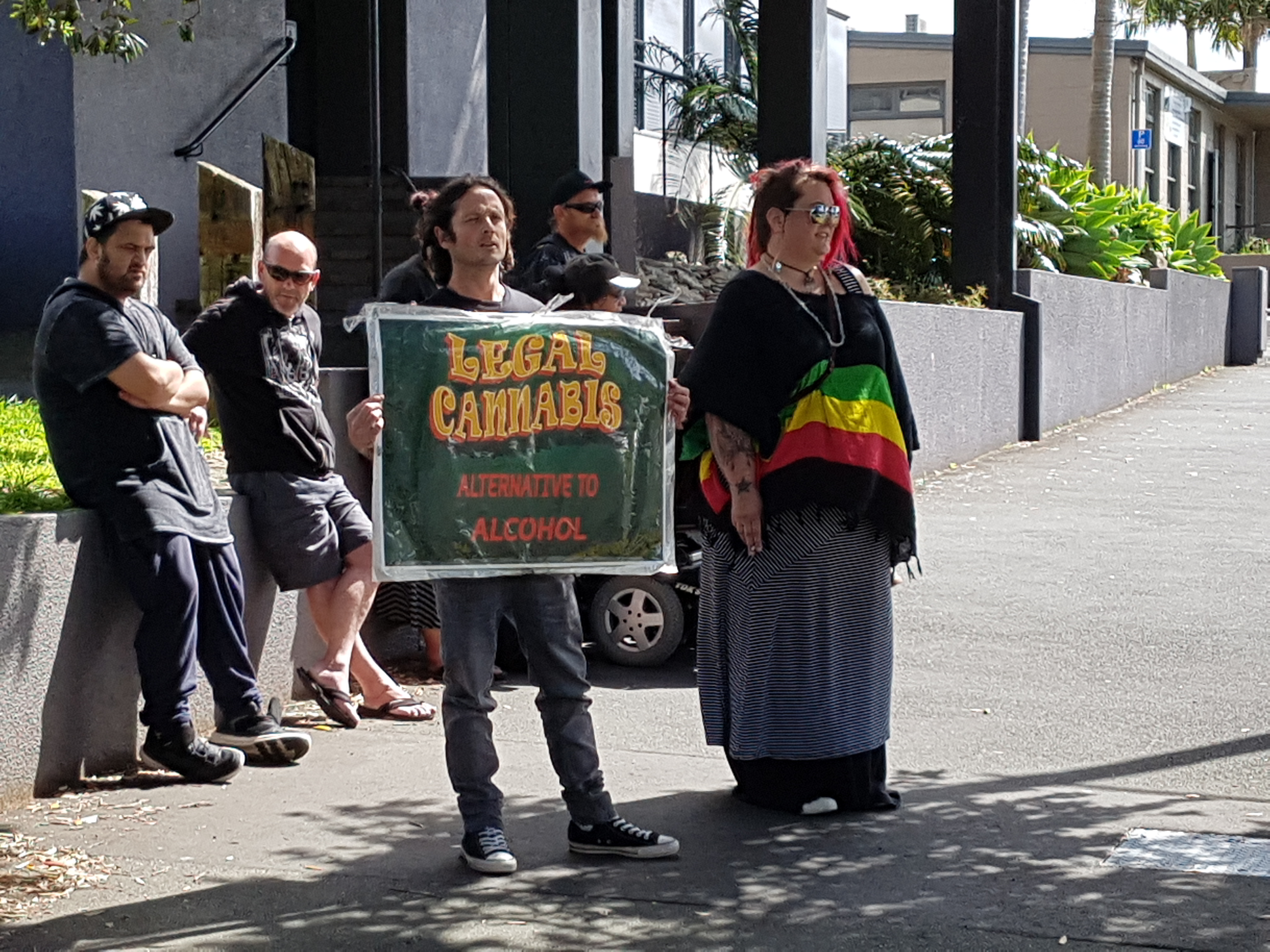 Daktory Social Club members Ronnie Vickery, left, and Mary-Jane on Bank St showing their support for Brian Borland and Sarah Gillgren during their trial. Photo / Imran Ali