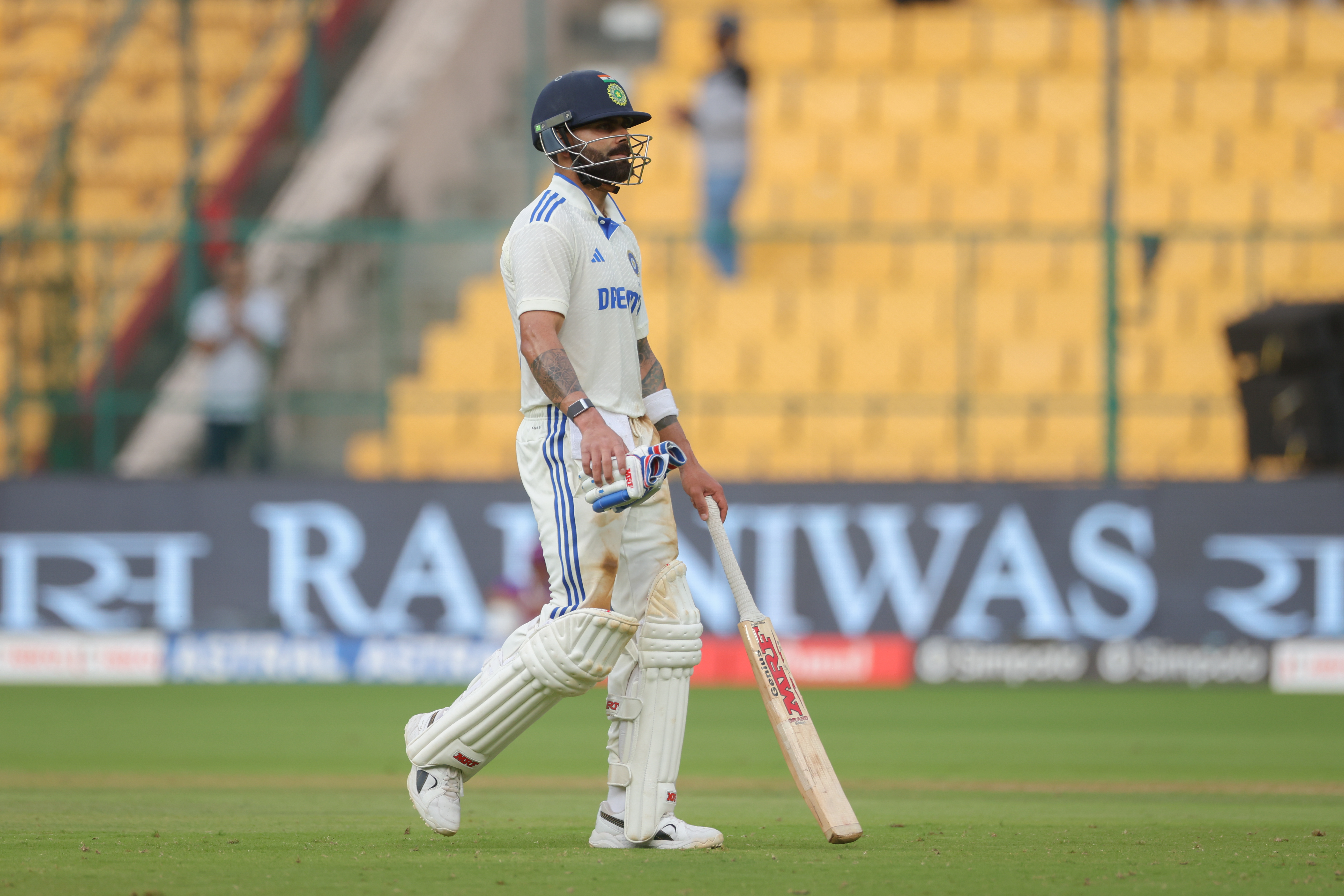 Virat Kohli walks off after being dismissed by Glenn Phillips. Photo / Getty Images