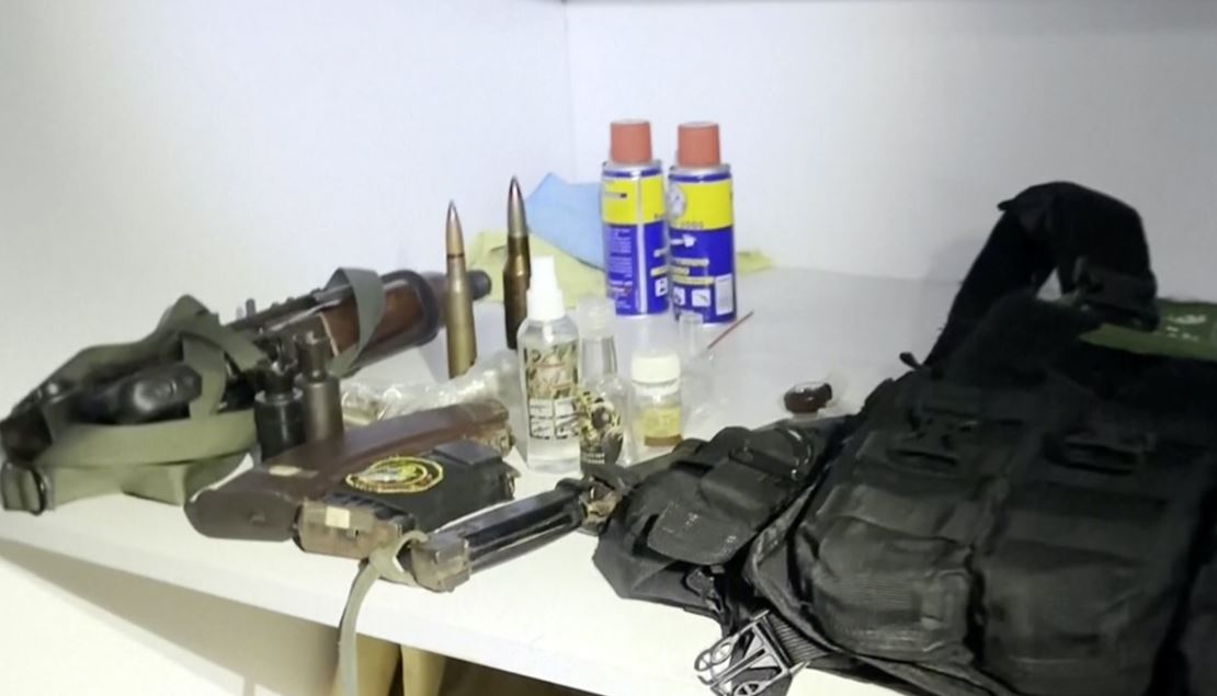 This image from a video released by the Israel Defence Forces on November 15 shows a bulletproof vest with a Hamas insignia and weapons the IDF says were found in a medical closet at Shifa Hospital. Photo / AP