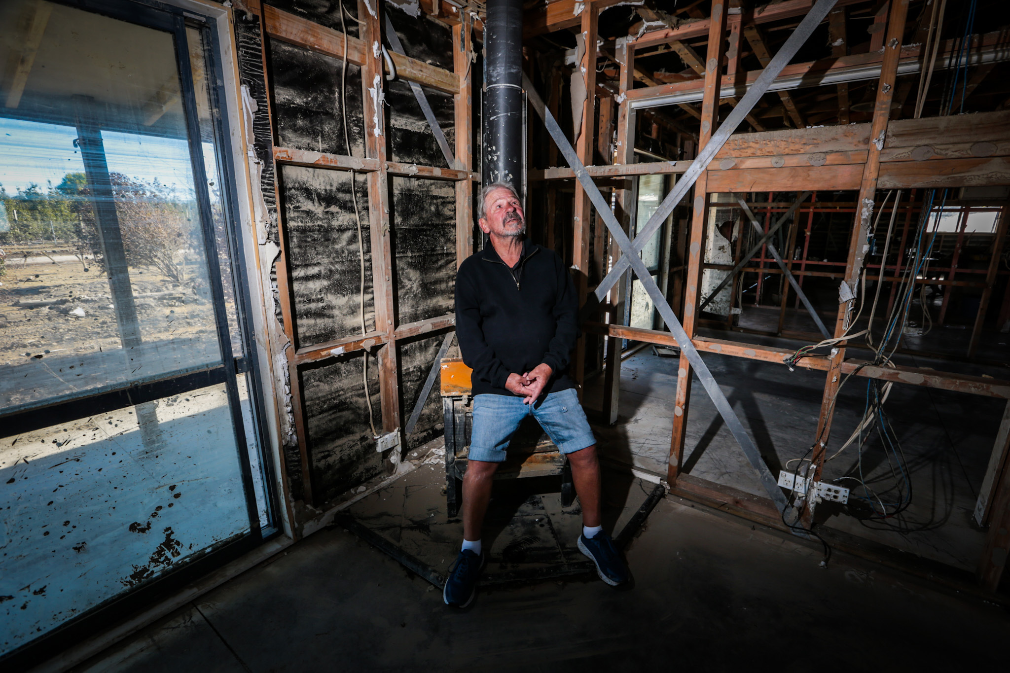 Mike Brown inside all that remains of his and wife Sue's home in Pakowhai. Photo / Paul Taylor