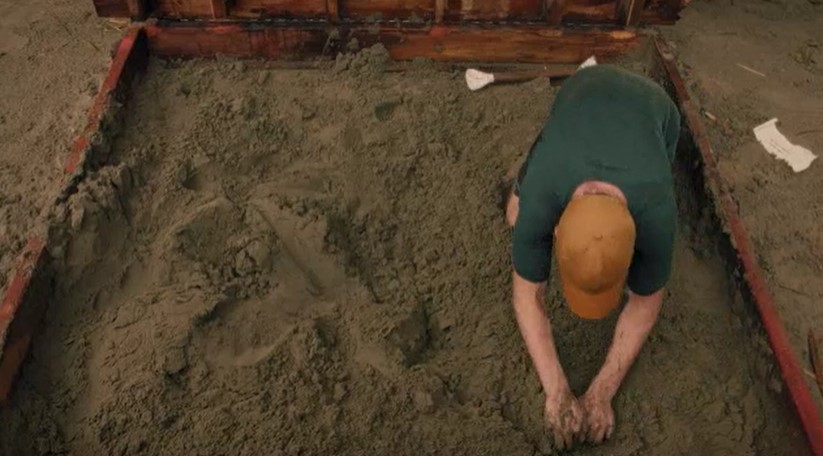 McLean digs for the treasure.