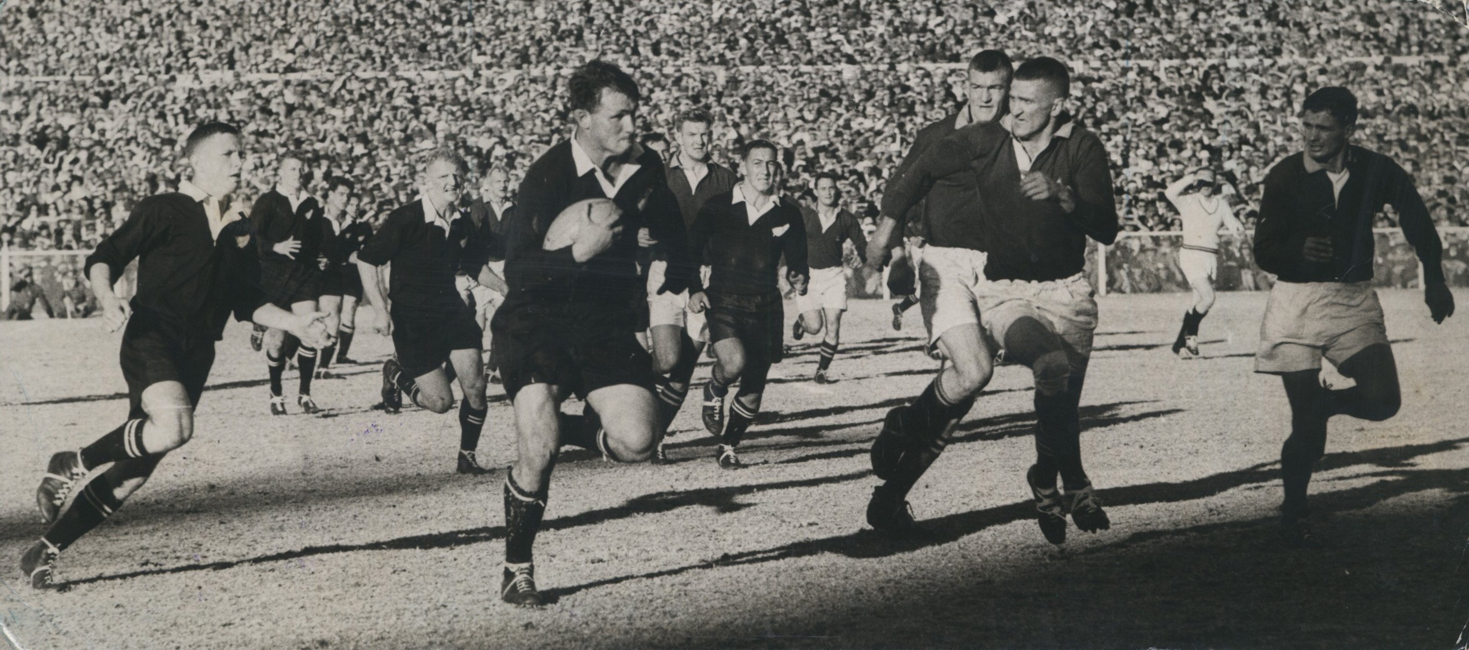 All Blacks forward Peter Jones runs at the Springboks defence, in 1960. Photo / NZME