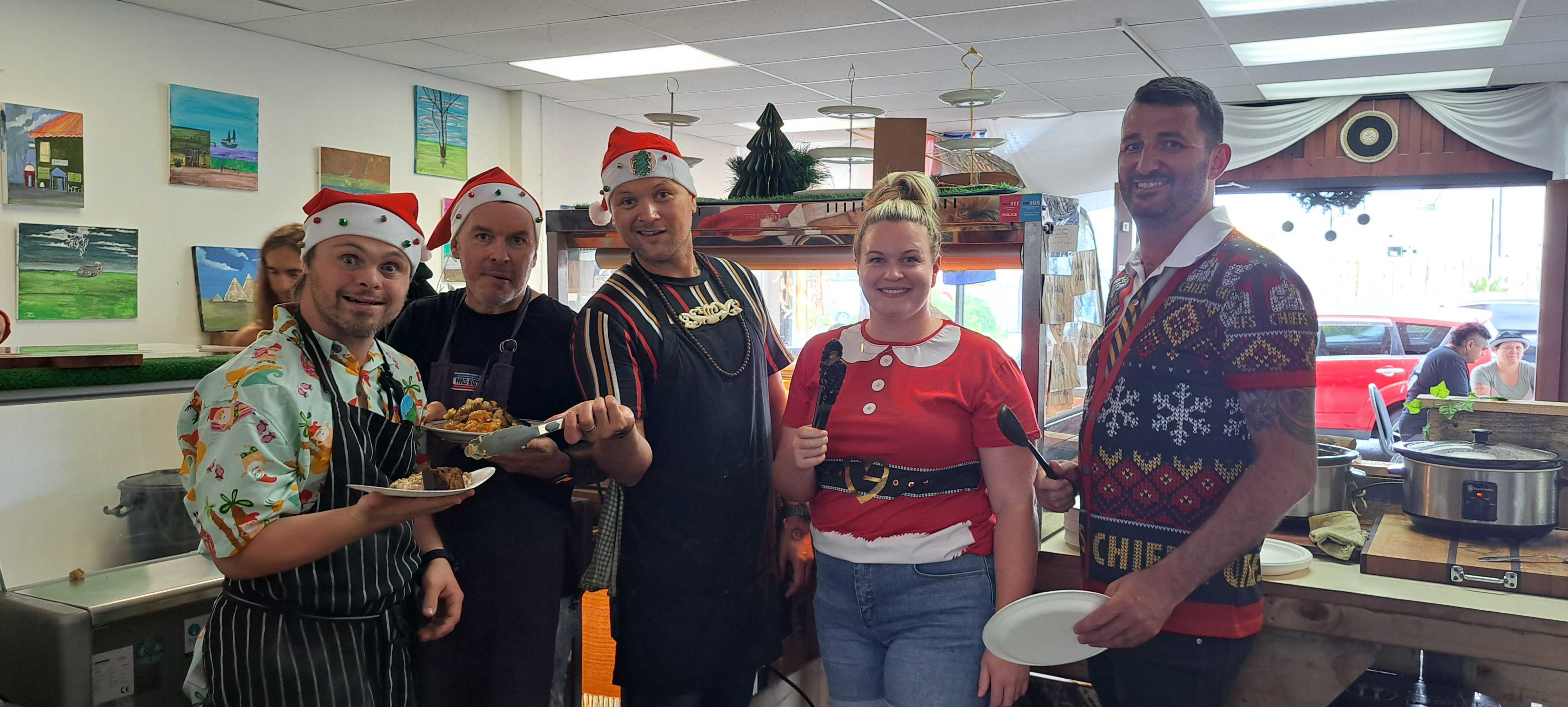 Volunteers at Palate Wholesome Collective's Christmas lunch taking some time to give to their community. Photo / Brodie Stone