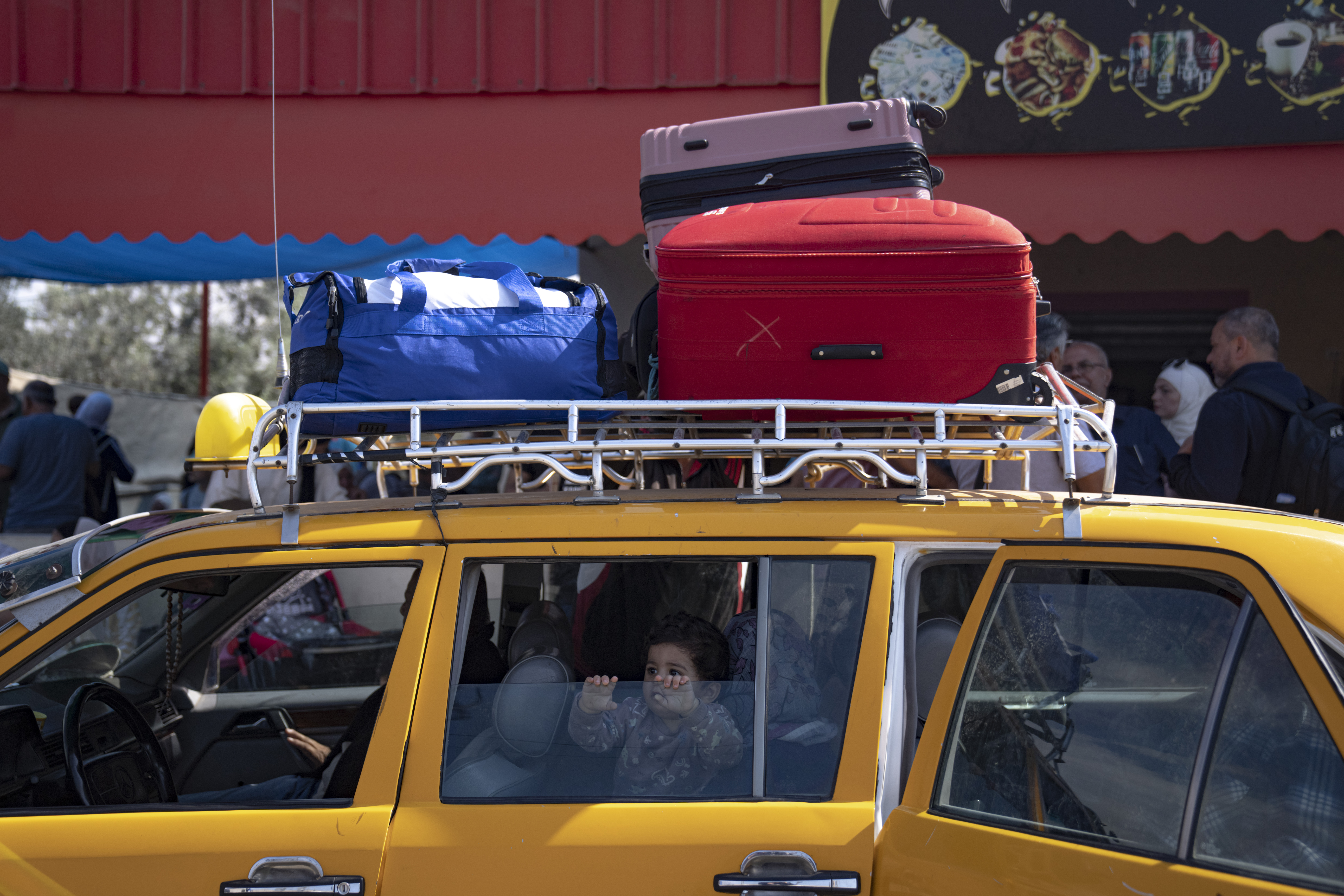 Palestinians wait to cross into Egypt at the Rafah border crossing in the Gaza Strip. Photo / AP