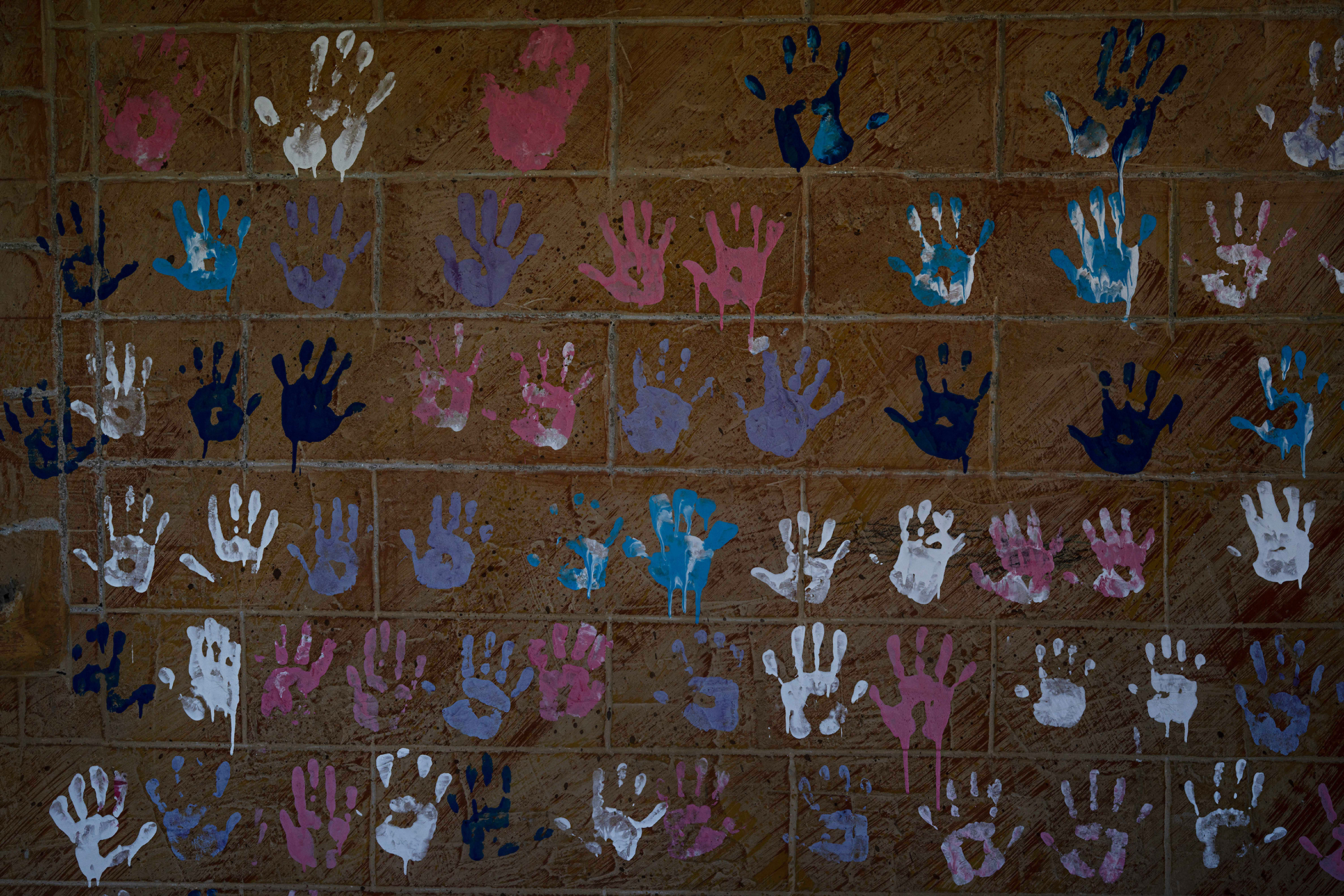 Children left their handprints on a wall in their school before settlers drove the village residents away. Photo / Samar Hazboun for The New York Times