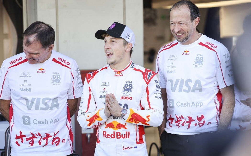 Liam Lawson (centre), Alan Permane (left) and Peter Bayer of Racing Bulls. Photo / AFP