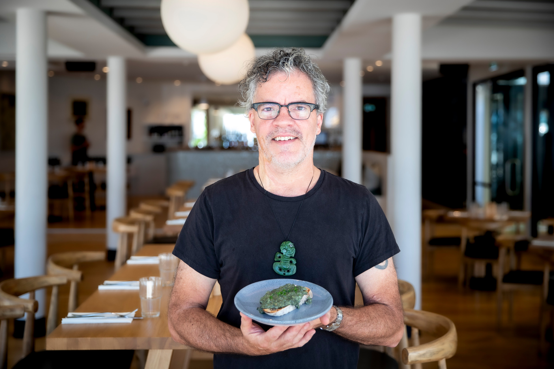 Peter Gordon with creamed pāua on toast, served at his new restaurant and cooking school, Homeland.  Photo/Michael Craig