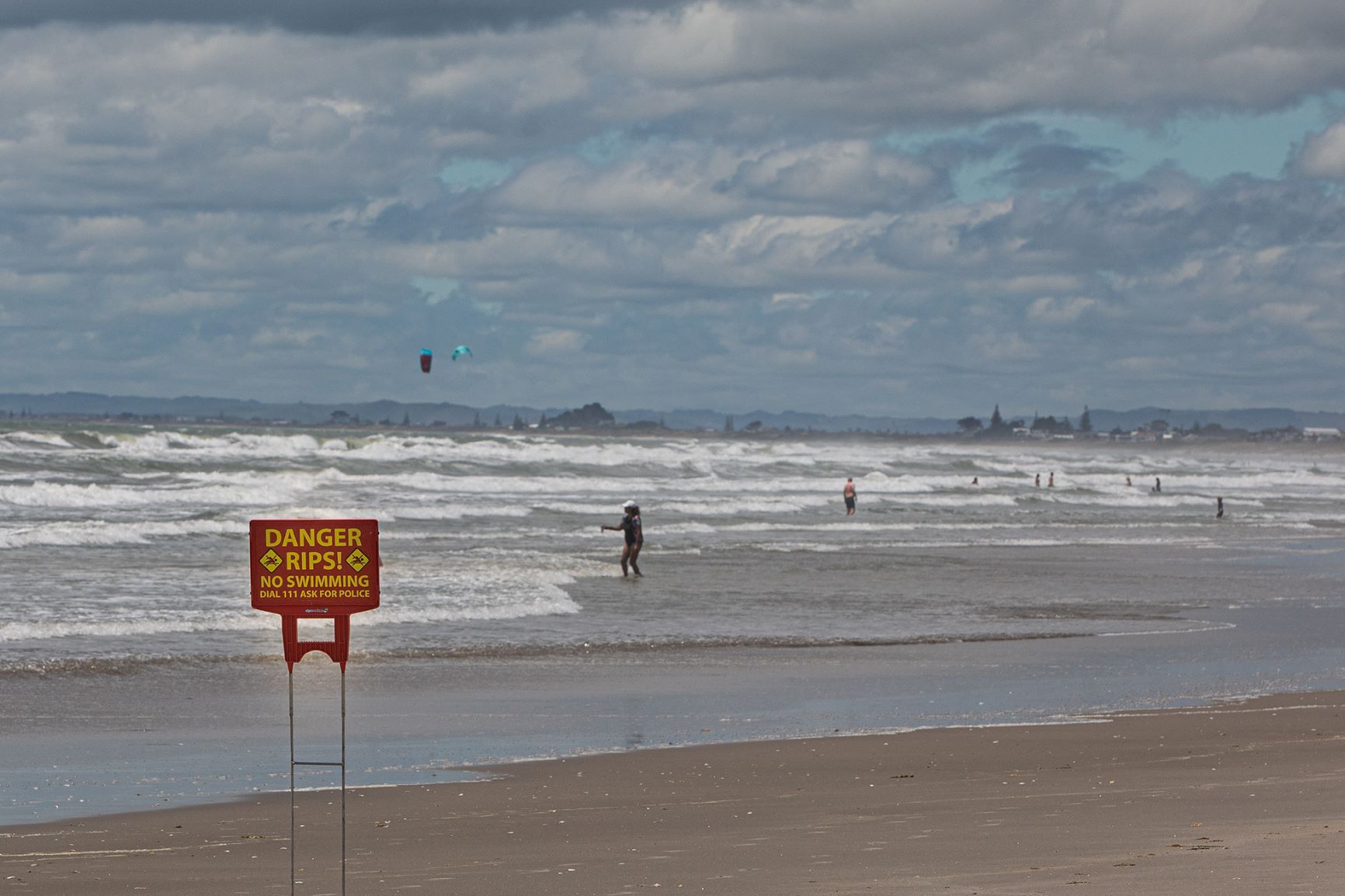 People in the surf between Tay St and Omanu Beach. Photo / Mead Norton