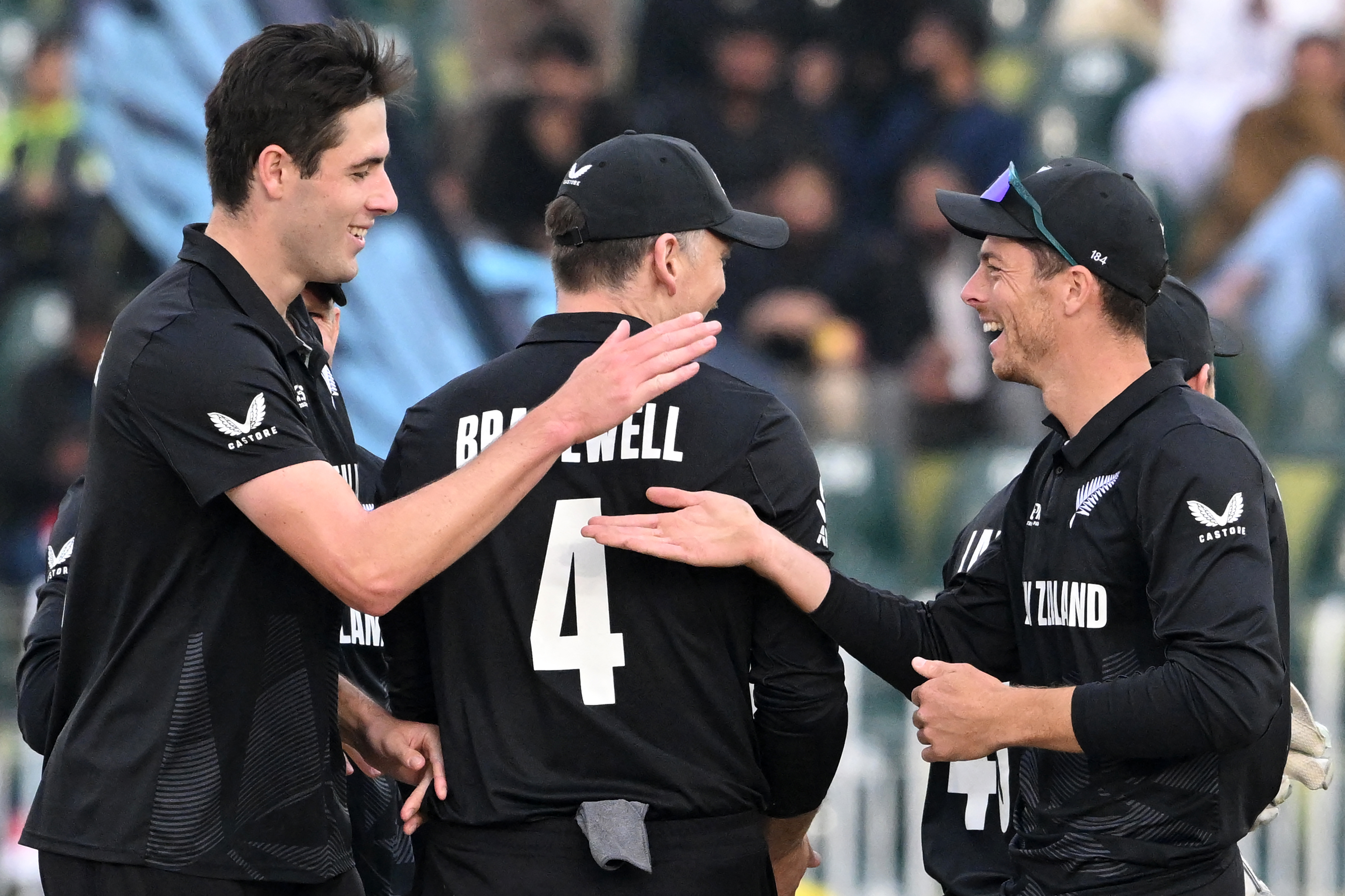 Will O'Rourke celebrates with captain Mitchell Santner. Photo / AFP