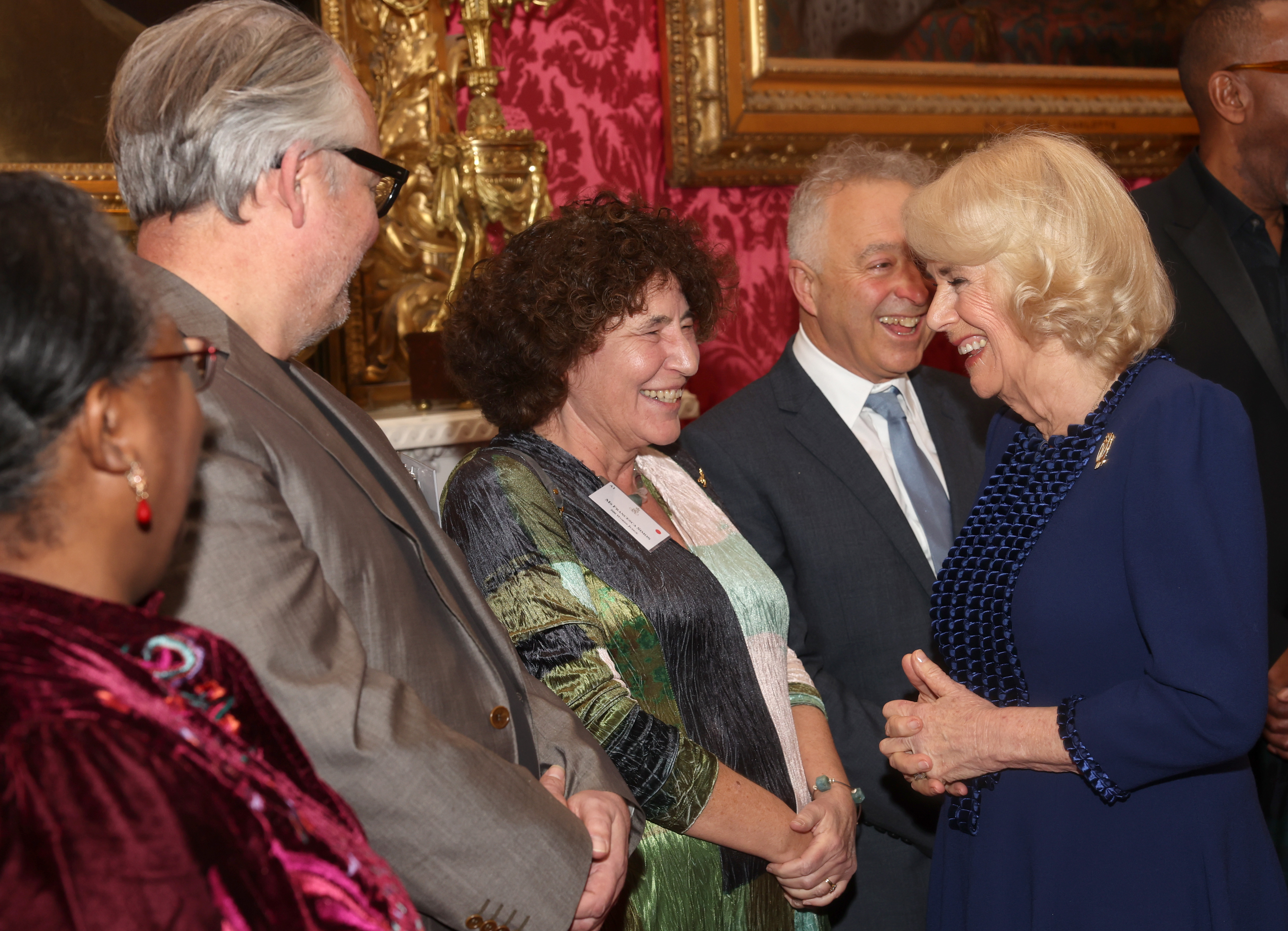 Queen Camilla shares a joke with Francesca Simon. Photo / Getty Images