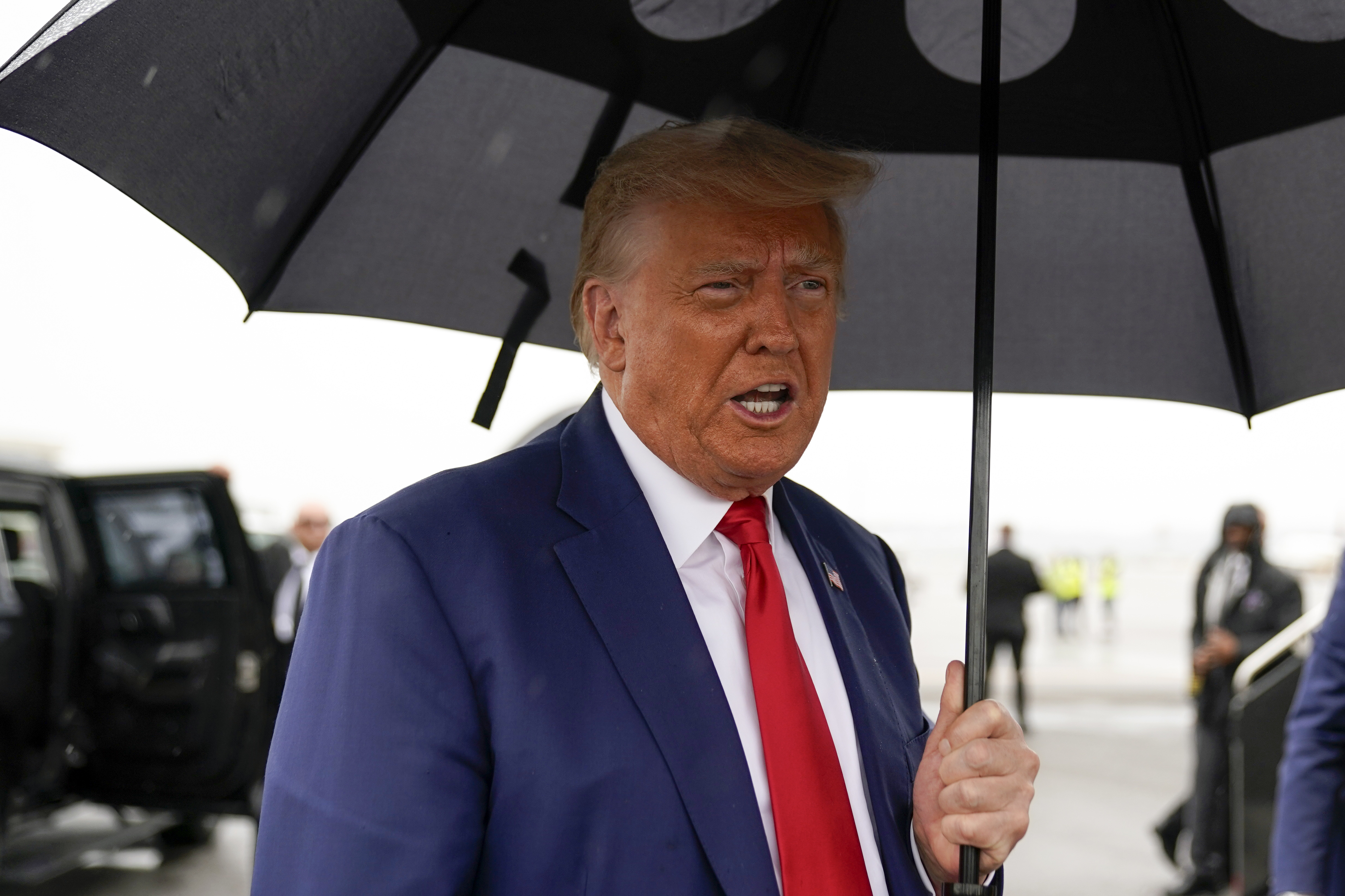 Former President Donald Trump speaks before he boards his plane at Ronald Reagan Washington National Airport after facing a judge on federal conspiracy charges that allege he conspired to subvert the 2020 election. Photo / Alex Brandon, AP