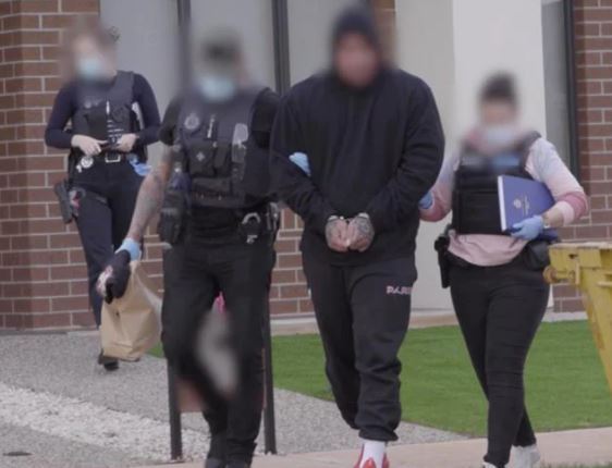 A man is arrested during a raid in Australia on Monday. Photo / Supplied