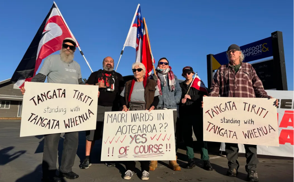 Protesters outside Kaipara District Council's August 7 meeting in Mangawhai air their views. Photo / Susan Botting