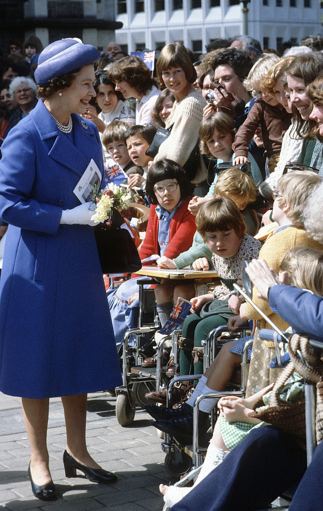 Queen Elizabeth ll smiles during a walkabout as she tours New Zealand in October 1981. Photo / Getty Images