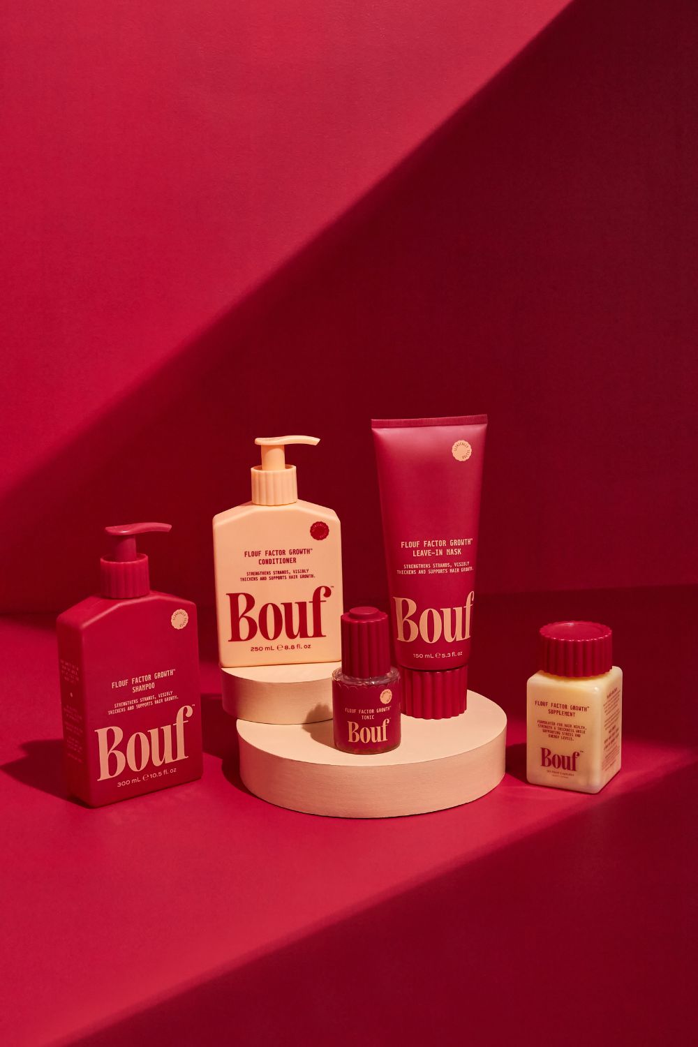 Bouf's signature cherry-red range of hair growth products launched into Farmers this week. Photo / Supplied