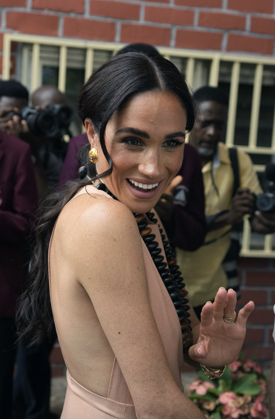 Meghan Markle and Prince Harry visit children at the Lights Academy in Abuja on Friday. Photo / AP