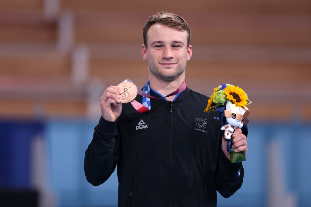 Kiwi trampolinist Dylan Schmidt with his bronze medal. Photo / Getty