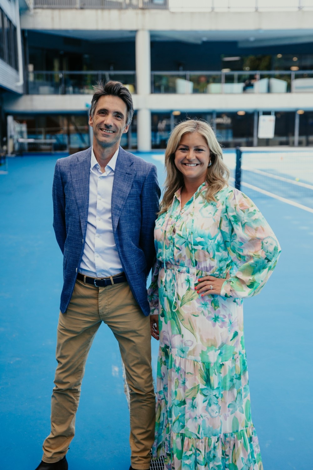 Toni Street wearing a signature floaty dress at the ASB Classic Tennis Launch in 2023, with tournament director Nicolas Lamperin.