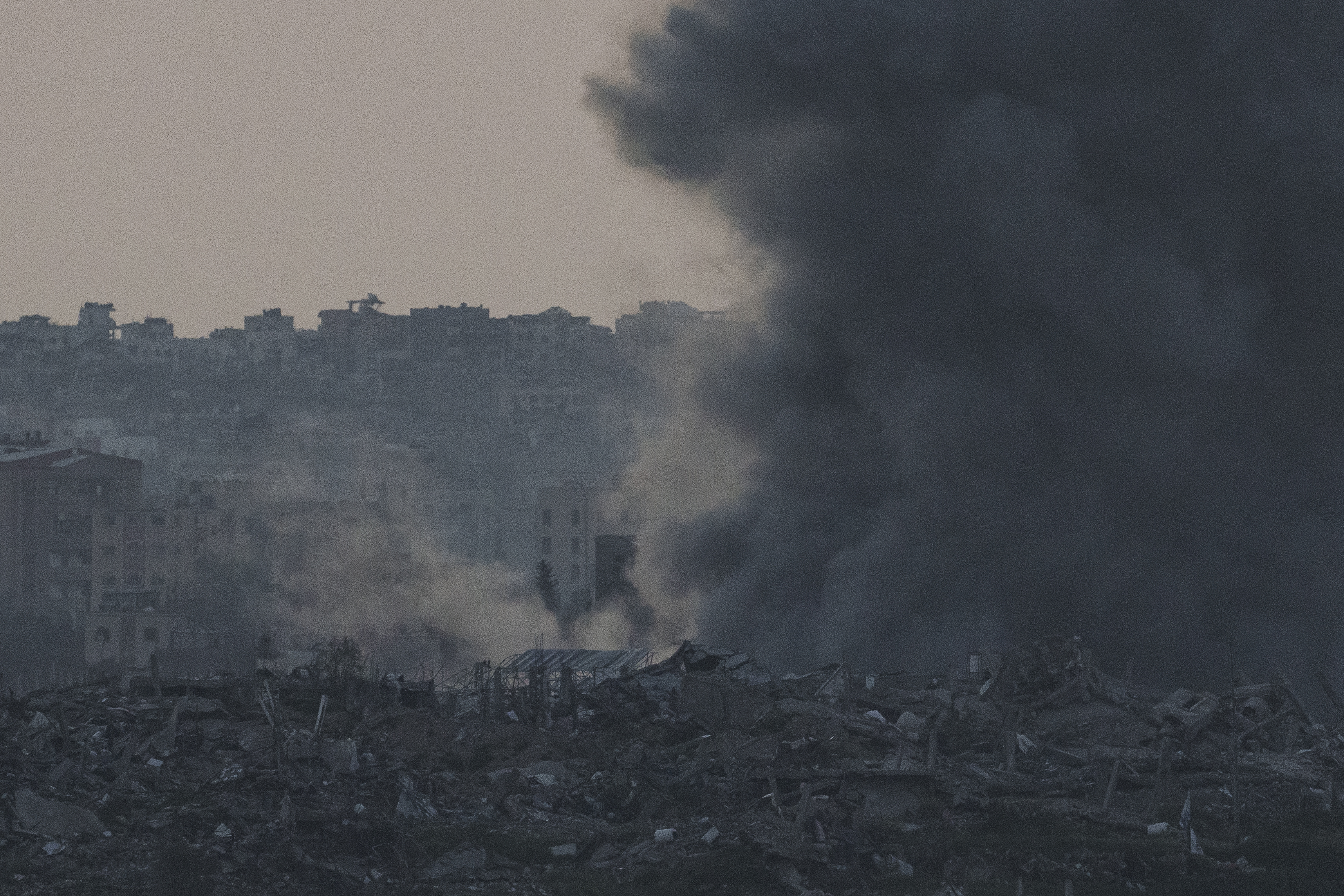 Smoke rises following an explosion in the Gaza Strip, as seen from southern Israel. Photo / AP