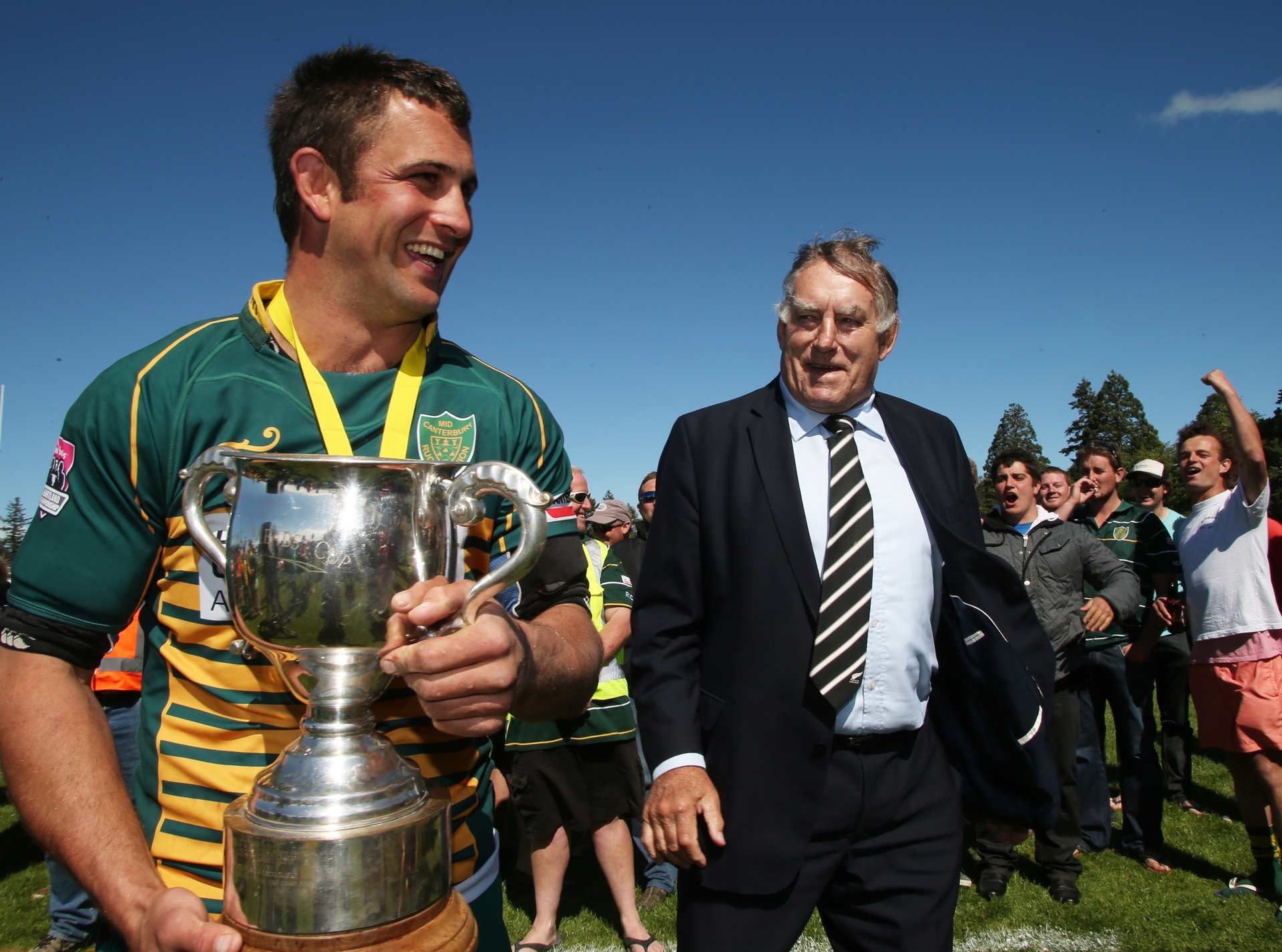 Mid Canterbury last held the Meads Cup in 2014, beating Buller in the final at Westport. They can end that drought this weekend. Pictured is captain Jon Dampney with the trophy and All Blacks great Sir Colin Meads in 2014. Photo / Ashburton Guardian