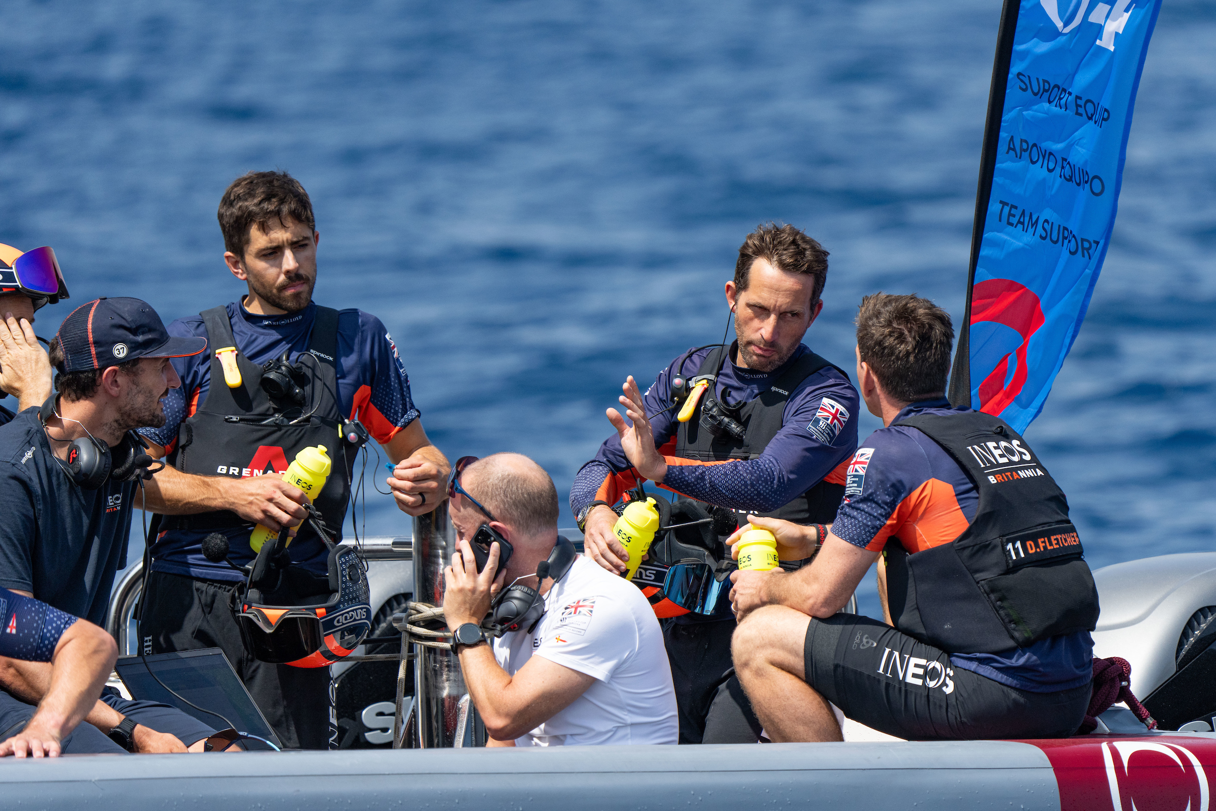 Sir Bein Ainslie debriefs with his Ineos Britannia team in Barcelona. Photo / Ian Roman, America's Cup