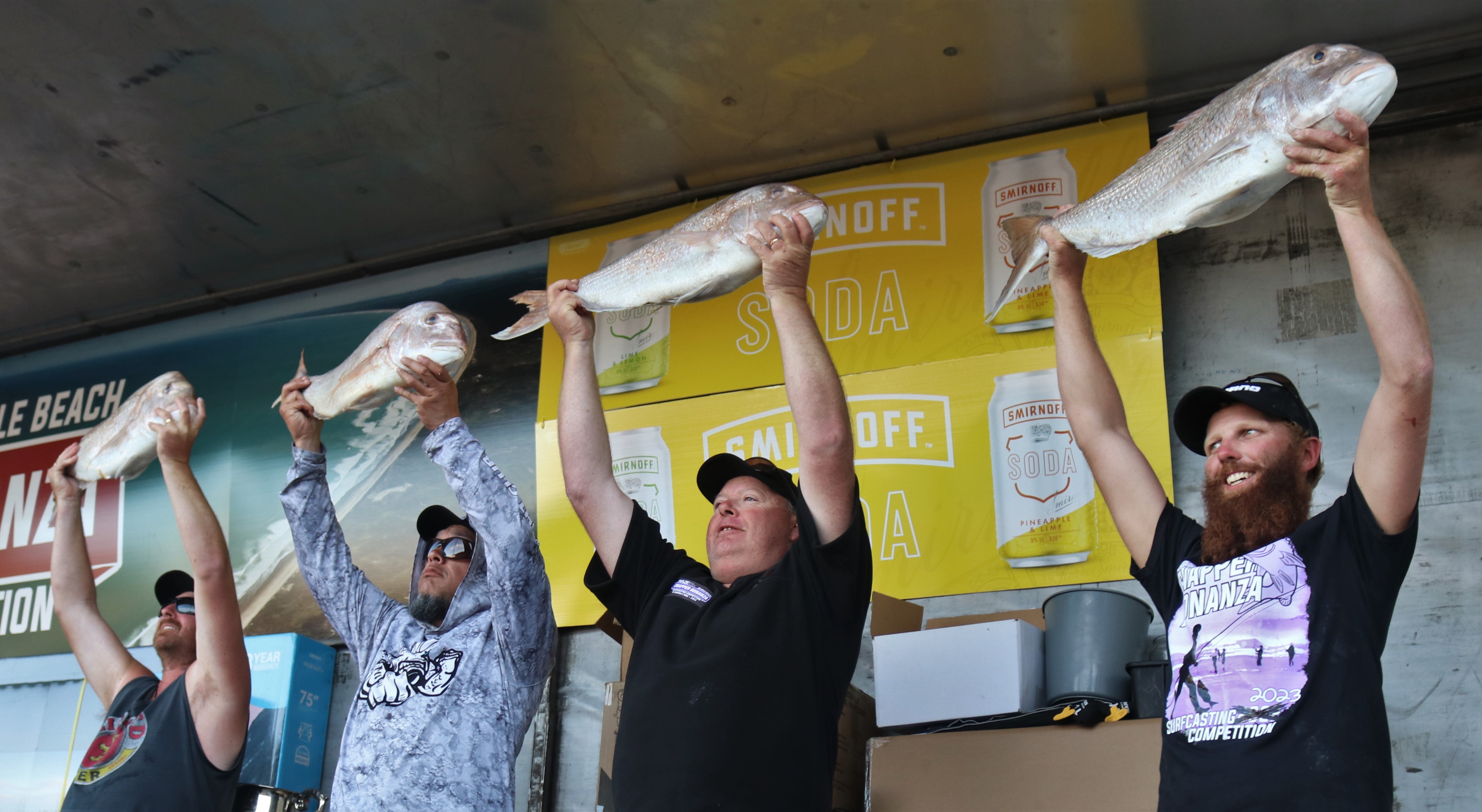 The winners of each day’s fishing show off their catches. Photo / Peter de Graaf