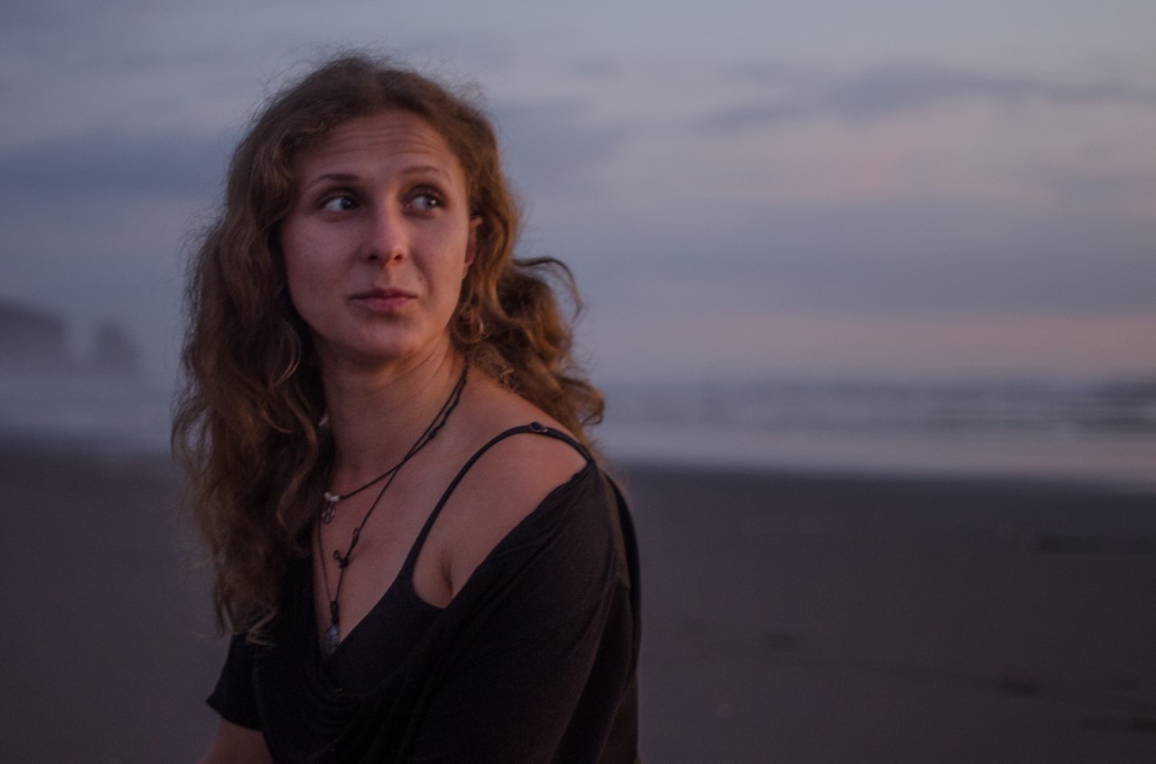 Masha Alekhina at Bethells Beach during Pussy Riot's 2019 tour of New Zealand.