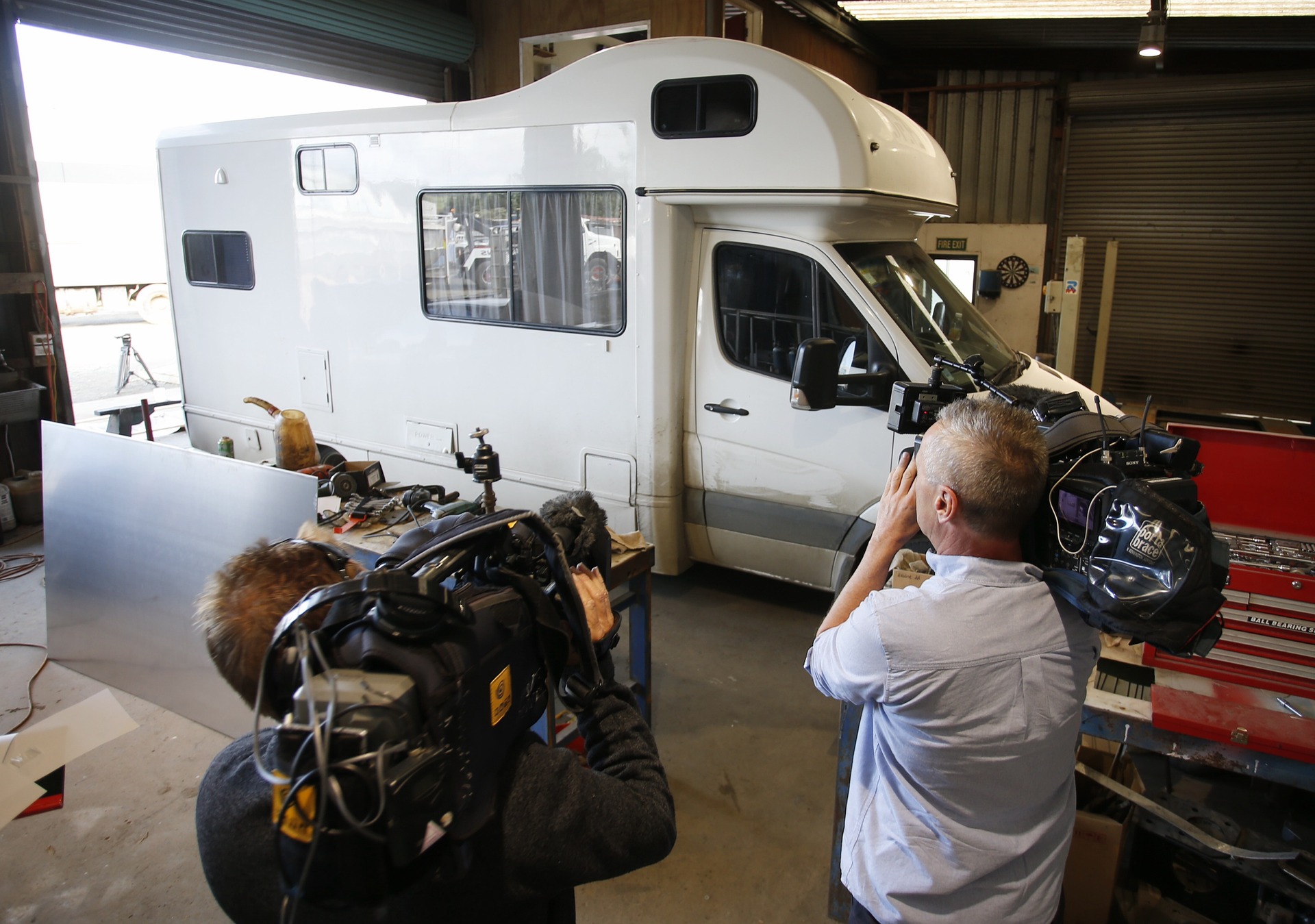 Media film the campervan after the discovery of 440kg of methamphetamine inside. Photo / Michael Cunningham